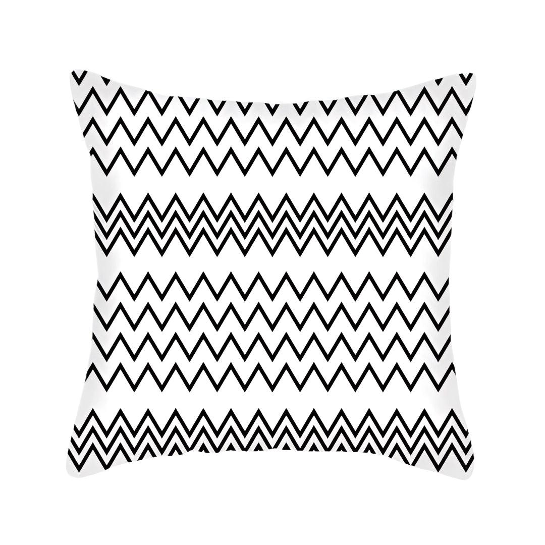 Geometric black and white pillow with modern abstract design, featuring symmetrical patterns including circles, parallel lines, and graphic elements, measuring 60 x 60 cm.