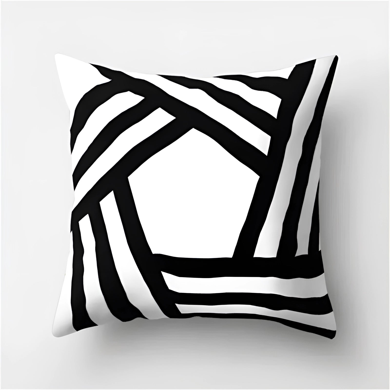 Black and white geometric patterned pillow with modern abstract design, measuring 60 x 60 cm, featuring bold graphic elements and clean lines.