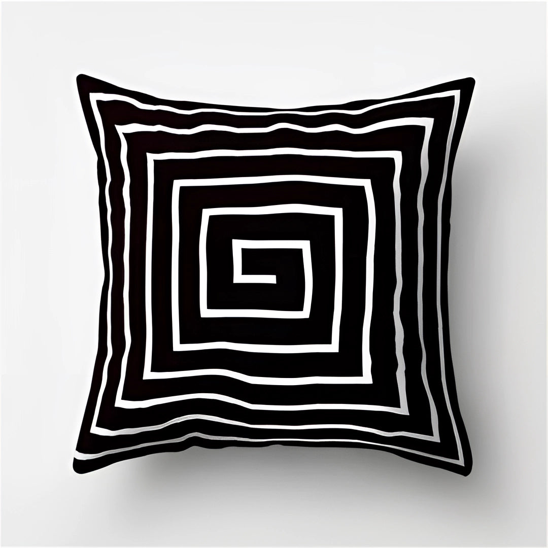 Modern abstract black and white geometric throw pillow with symmetrical pattern, measuring 60 x 60 cm.