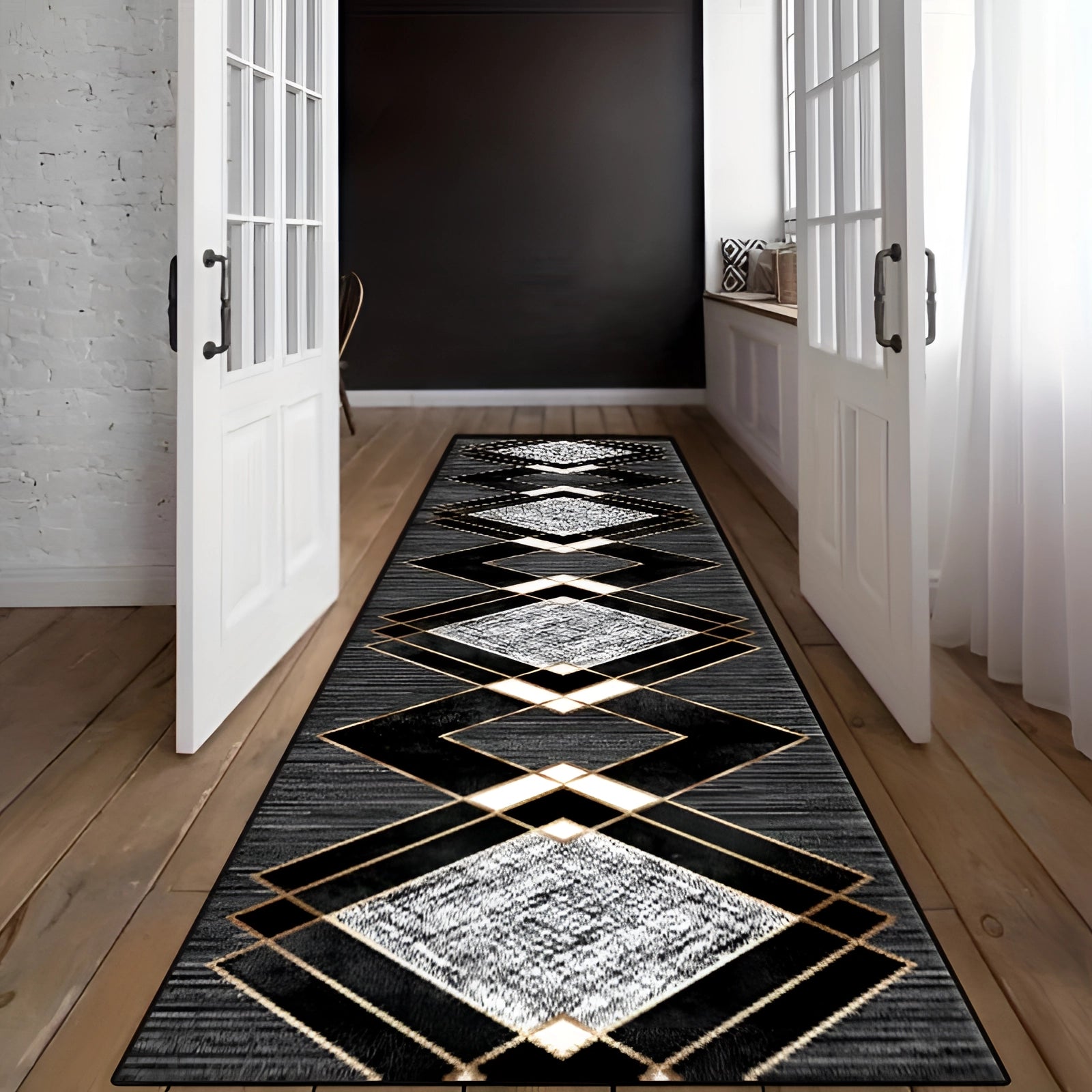 Black and white geometric diamond patterned hallway runner on wooden tile flooring in an interior setting.