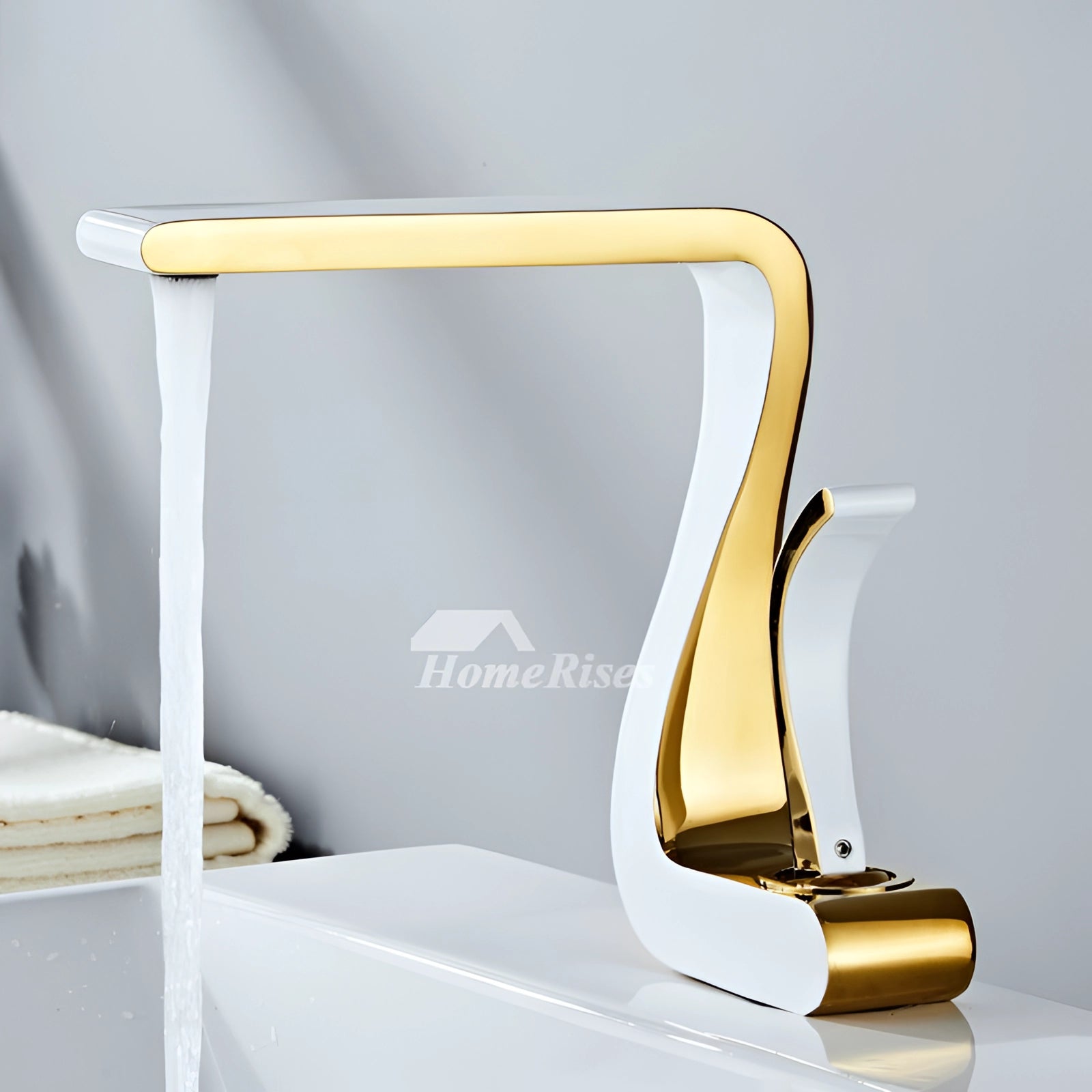 Gold bathroom faucet with a modern square design, showcasing a luxurious finish and sleek, contemporary lines.