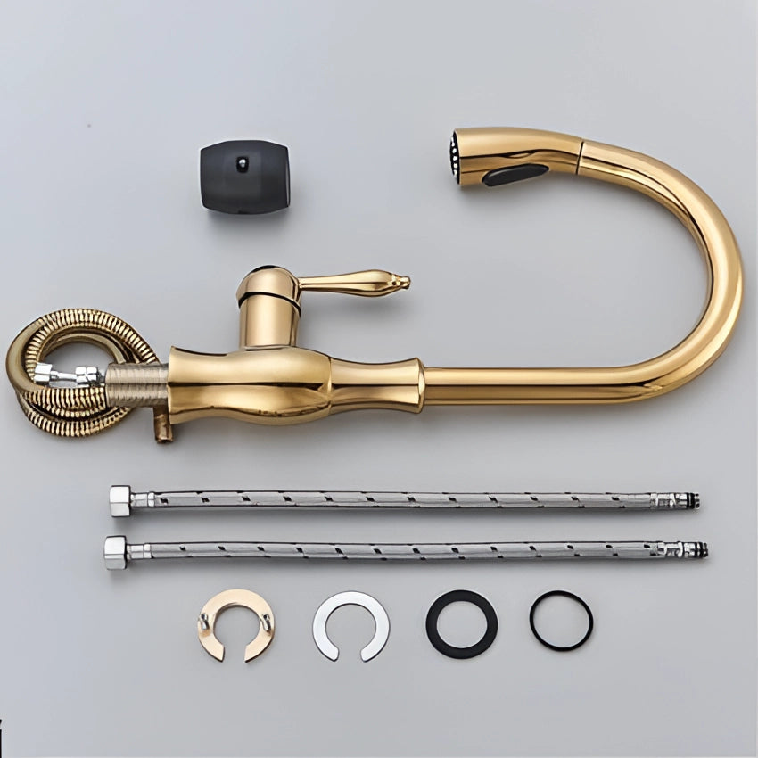 Gold brass kitchen faucet with a pull-down spray feature, high-arc design, and a modern aesthetic.