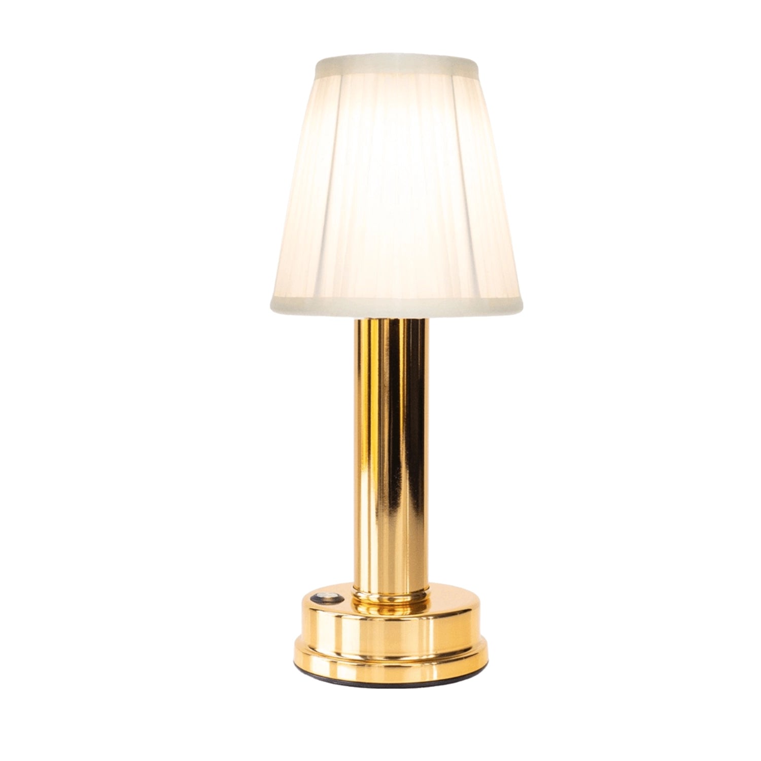 Luxurious gold and brass table lamp with a rectangular fabric lampshade, elegantly designed for bedside lighting, shown on a wooden table in a stylish interior setting.