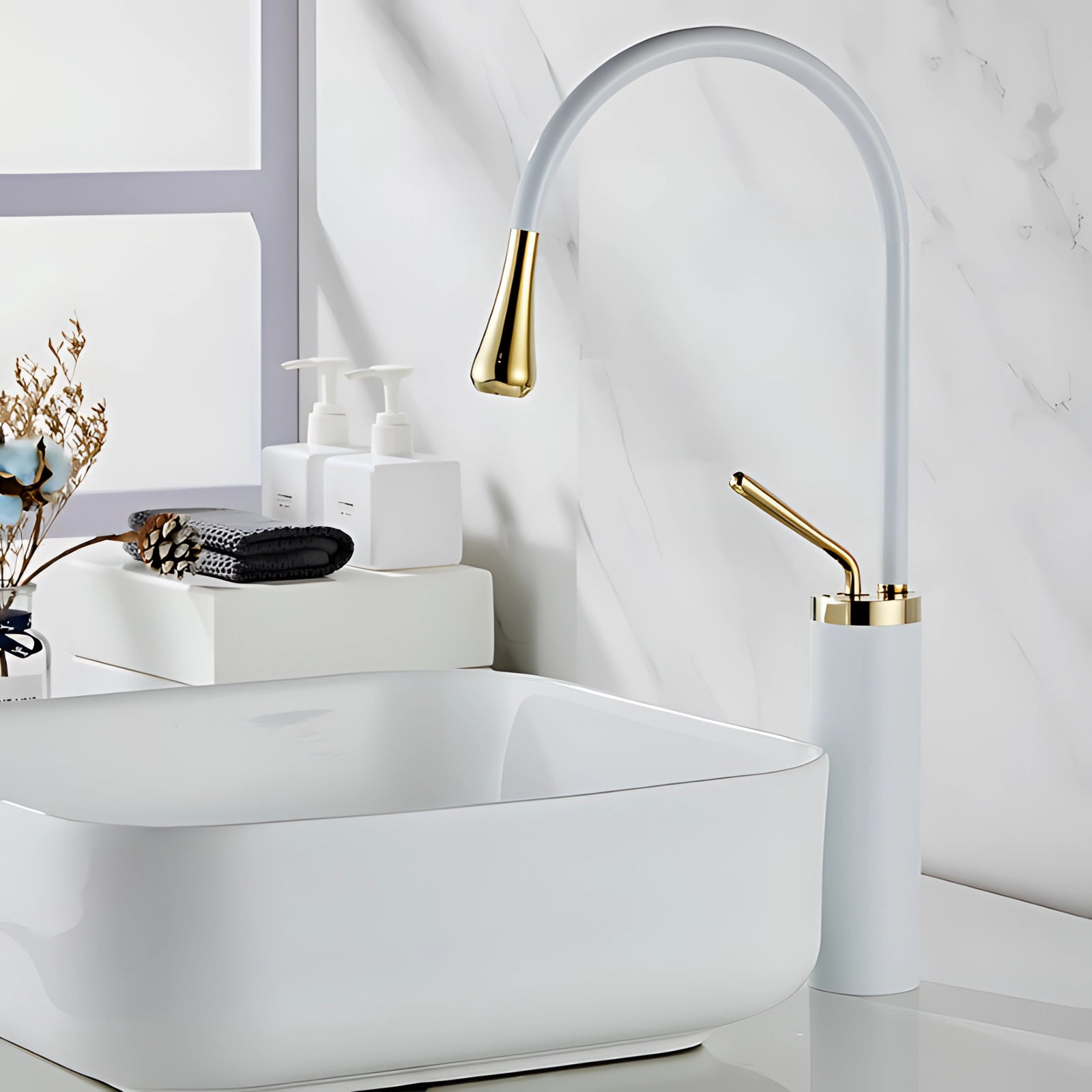 Elegant white gold kitchen faucet with a luxurious brass finish, high-arc spout, and sleek design, set against a stylish interior with wooden accents and a touch of greenery.