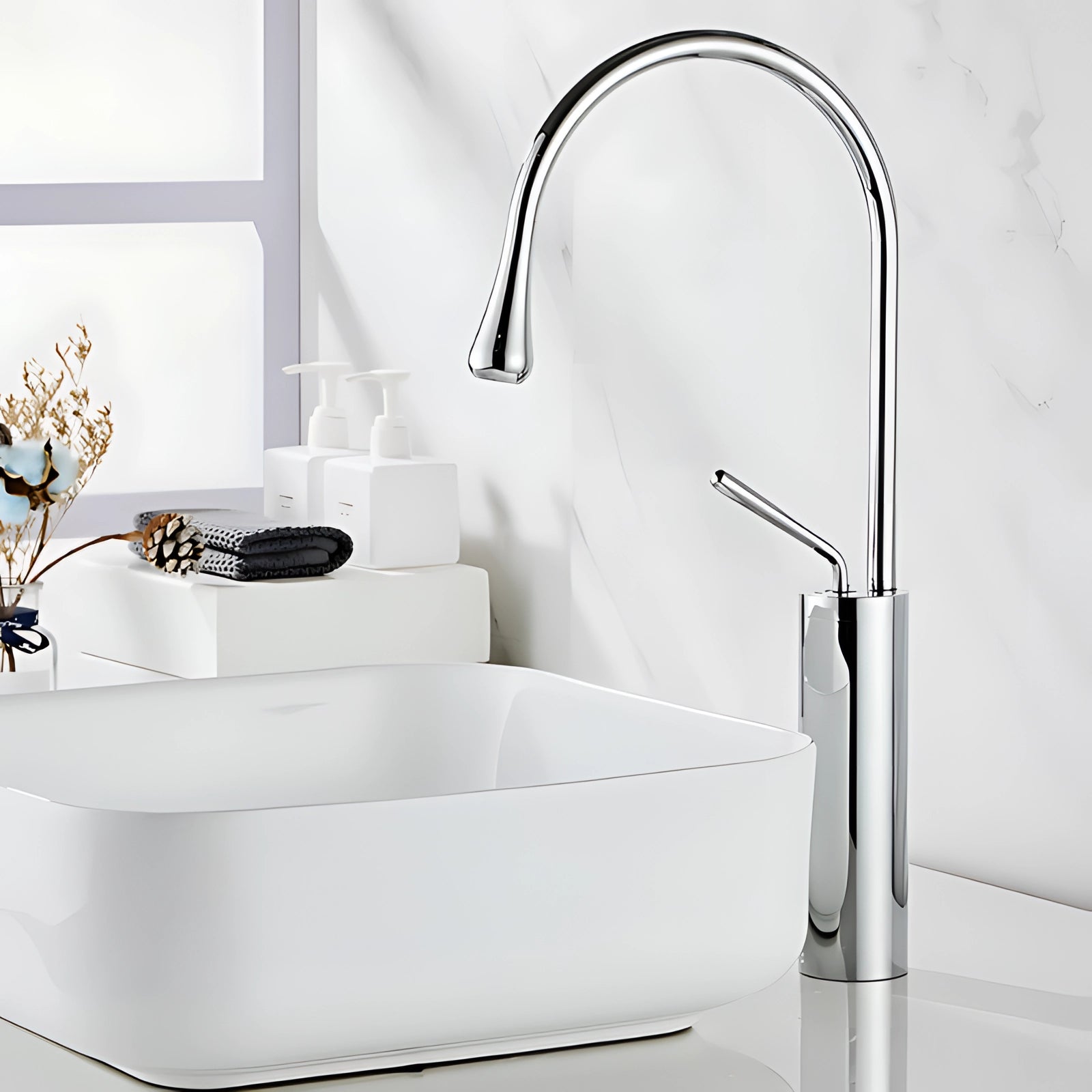 Elegant chrome kitchen faucet with a high-arc spout featuring a sleek design and luxurious metallic finish.