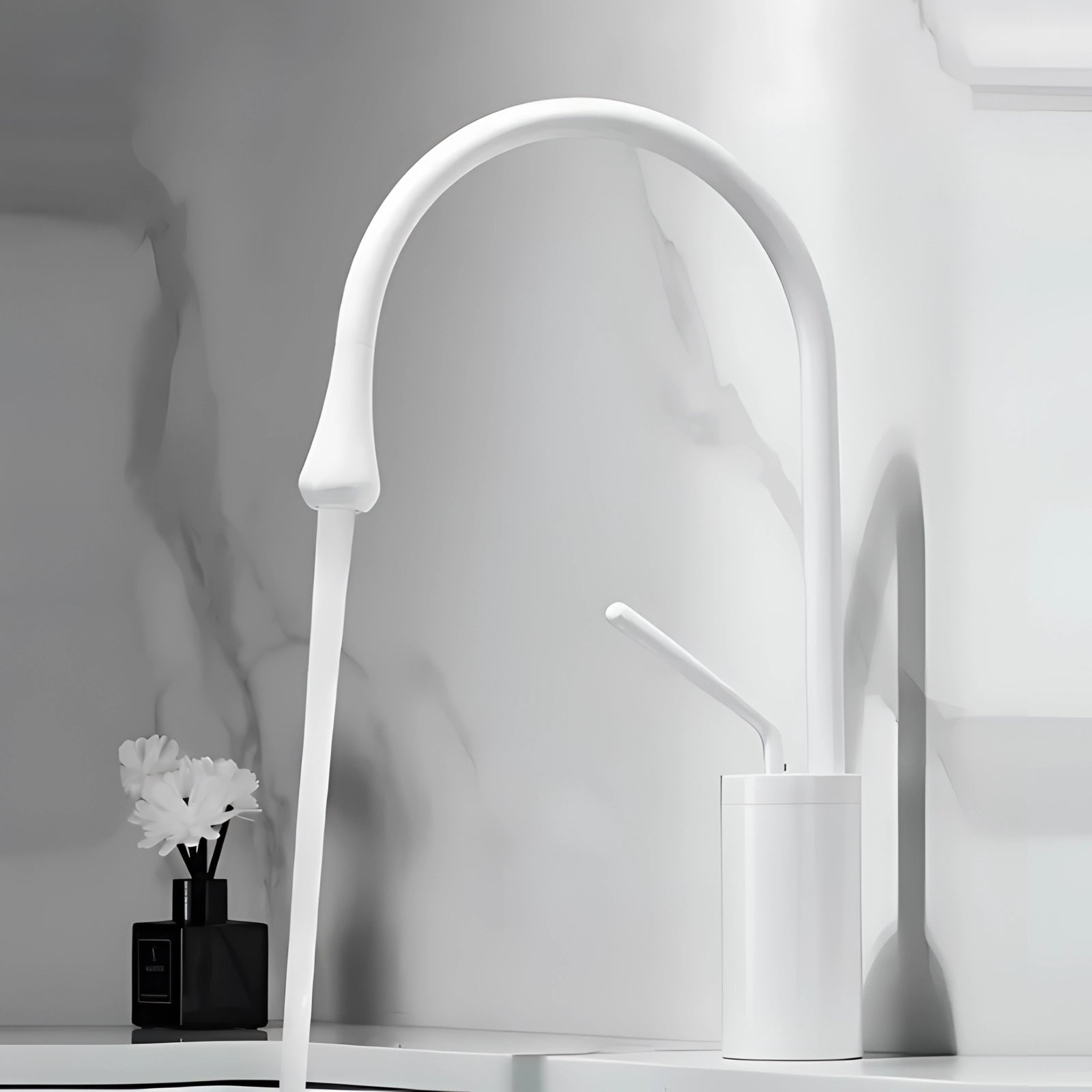 Elegant white and gold kitchen faucet featuring a high-arc spout, shown in a modern setting with a stylish brass design.