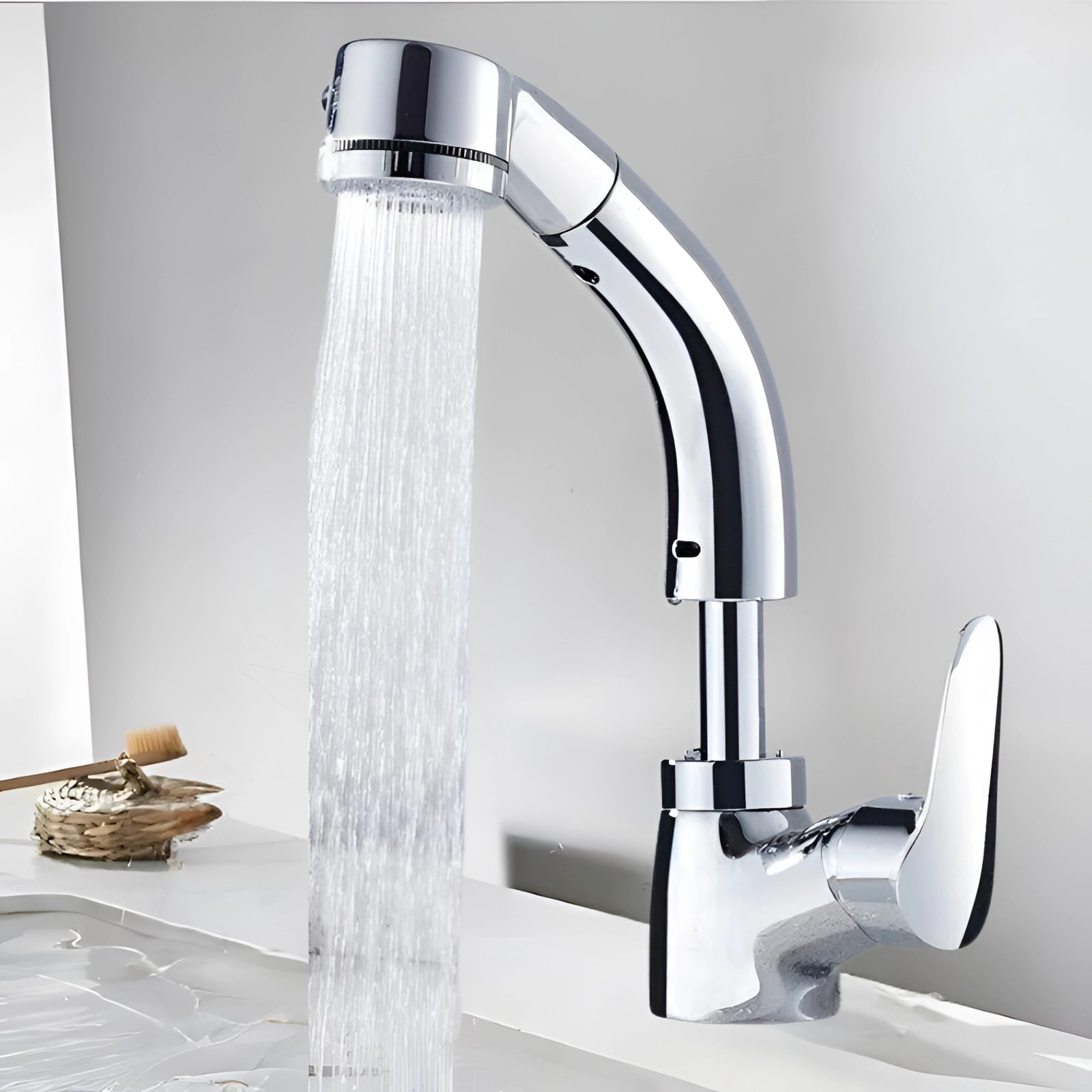 Chrome kitchen faucet with a sleek, modern luxury design, featuring a pull-out sprayer, elegantly integrated into a stylish interior setting.