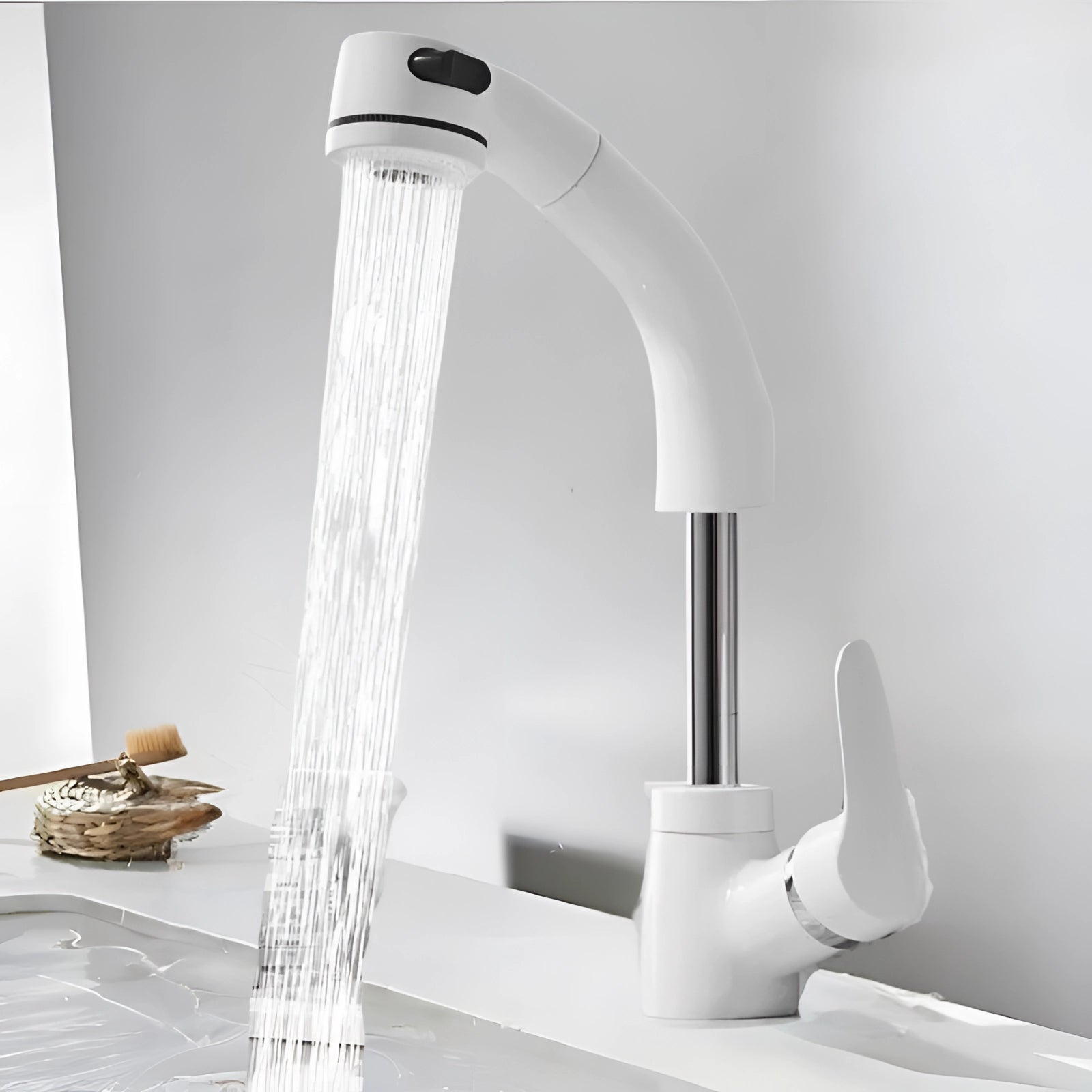 Gold kitchen faucet with pull-out sprayer in a modern luxury design, shown in a white finish, installed on a wooden kitchen countertop.