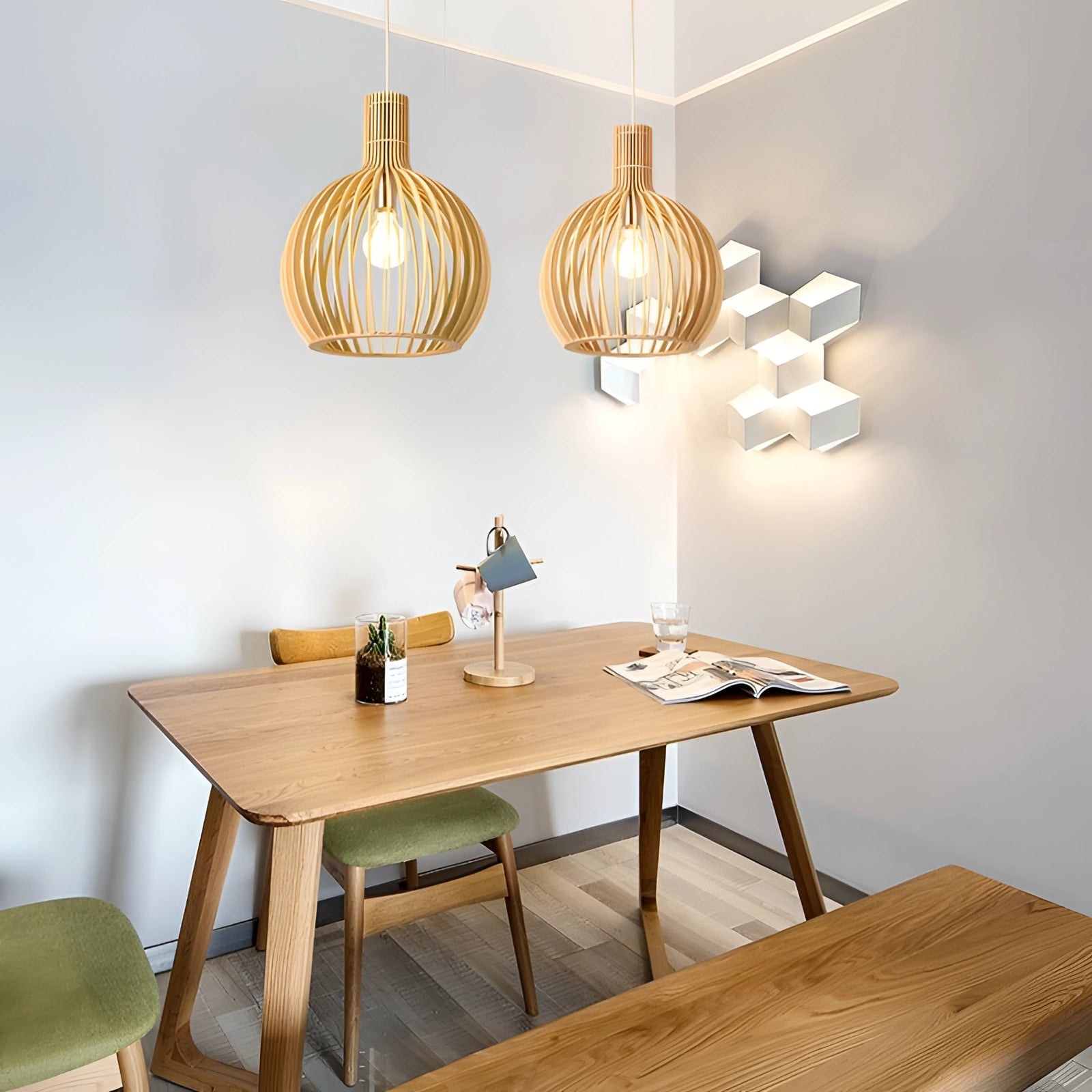 Golden wooden pendant light in a modern dining room setting, featuring a classic wood design with a 45 cm diameter, elegantly suspended above a wooden table and complementing the interior design with its warm tones and natural materials.