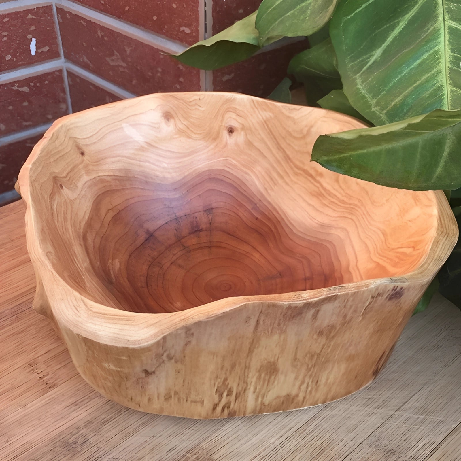 A hand-carved rustic wooden bowl showcasing unique wood grain, made from eco-friendly materials.