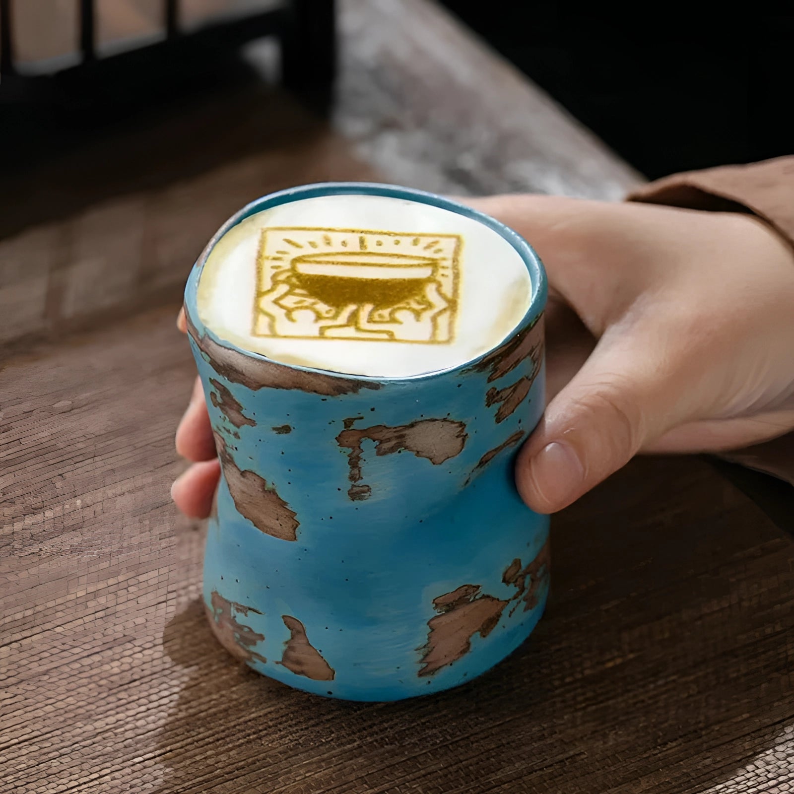 Handcrafted blue ceramic cup with a vintage style, featuring a smooth, glossy finish and a classic tumbler shape.