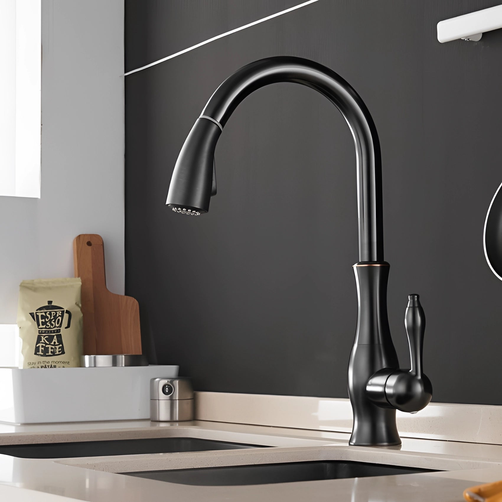 Black high-arc stainless steel pull-down kitchen faucet with brushed nickel finish, installed over a grey sink in a modern interior design setting.