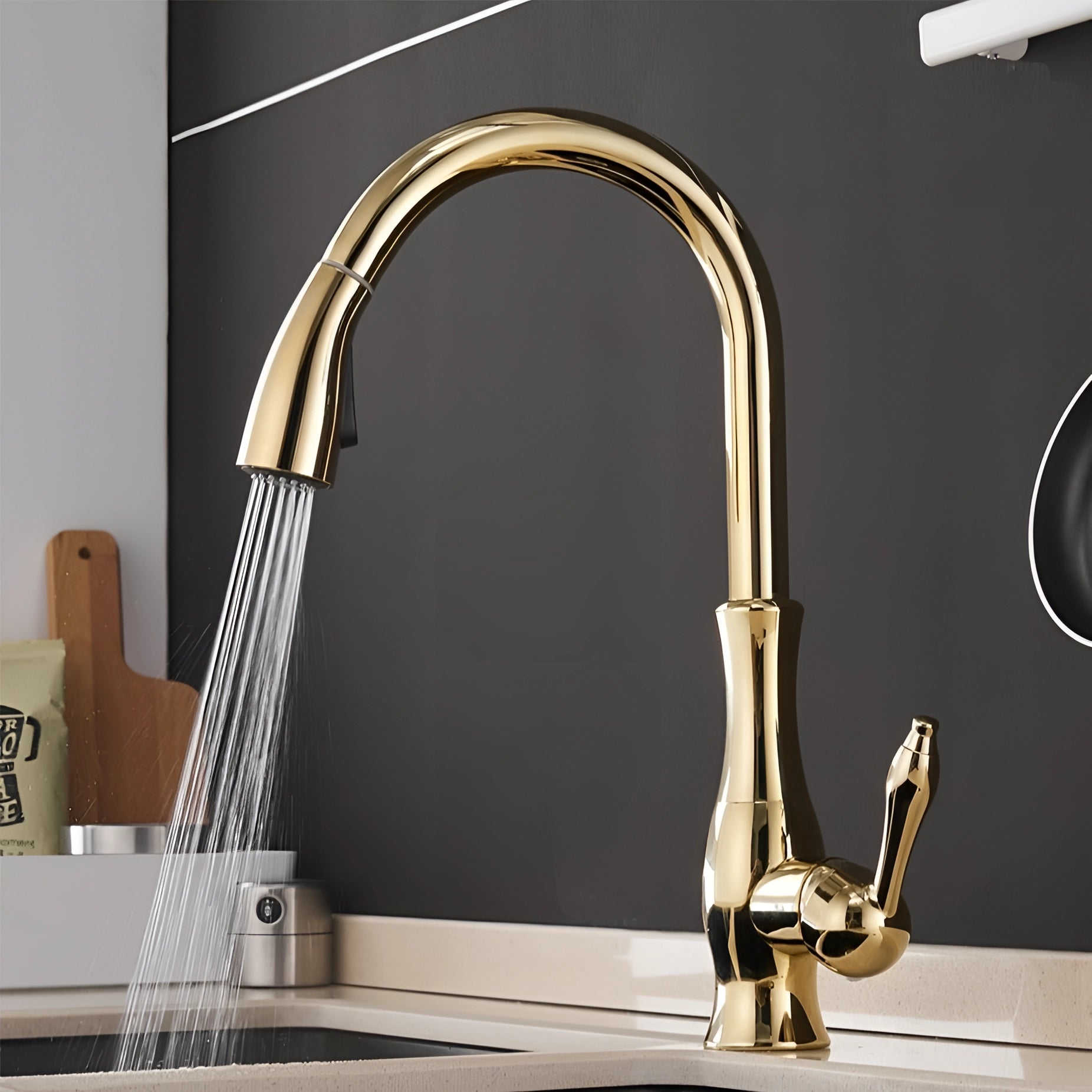 High-arc gold kitchen faucet with a pull-down sprayer, set against a kitchen sink, showcasing a brushed nickel finish and sleek design.