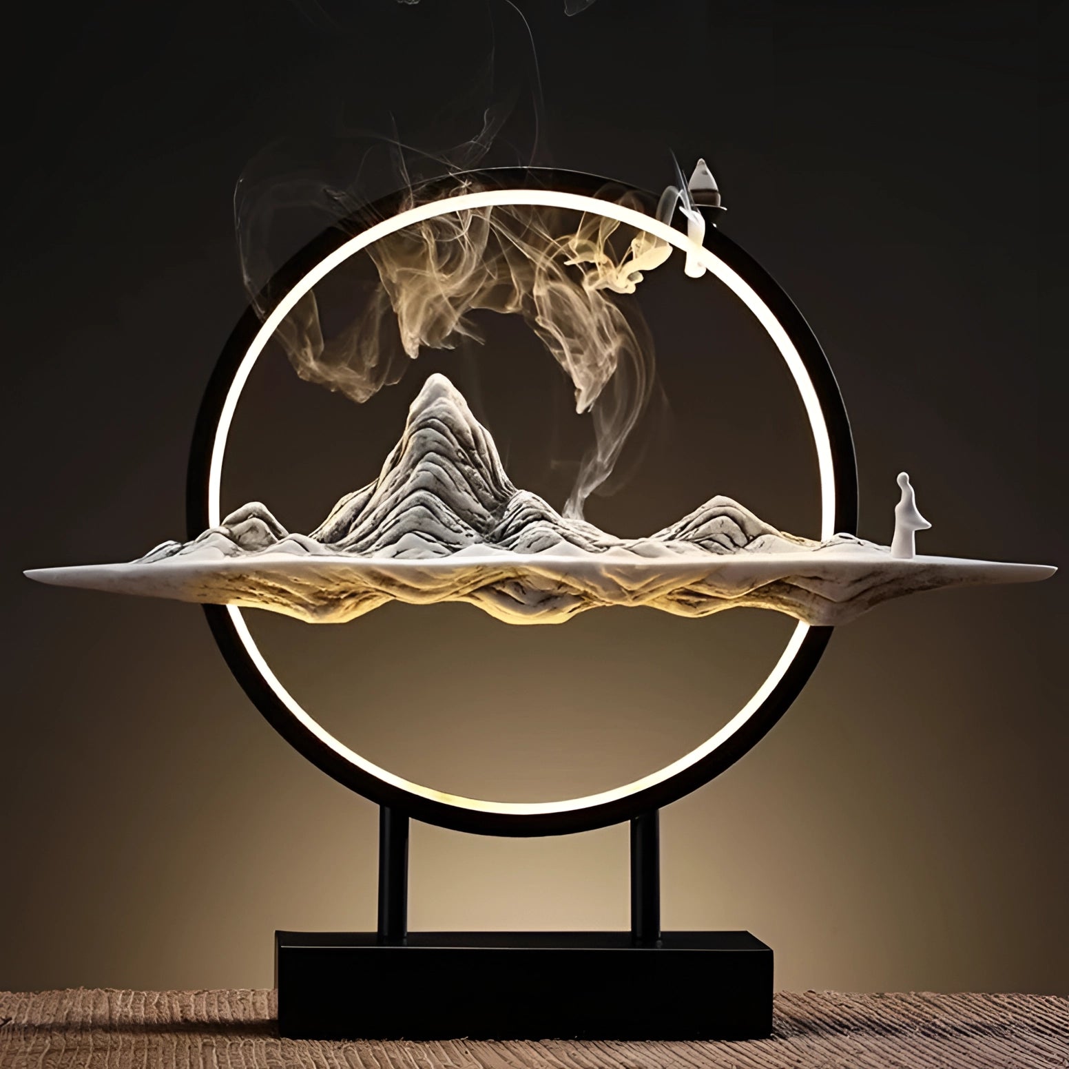 Illuminated Mountain LED Circle Art piece with dynamic smoke and light effects, featuring a circular design and metallic accents.