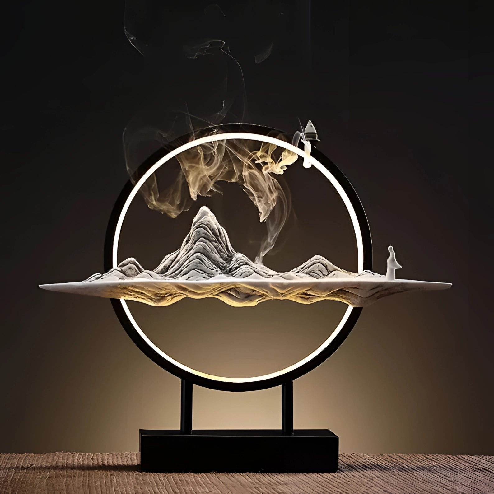 Illuminated Mountain LED Circle Art featuring dynamic smoke and light effects, displayed on a table.