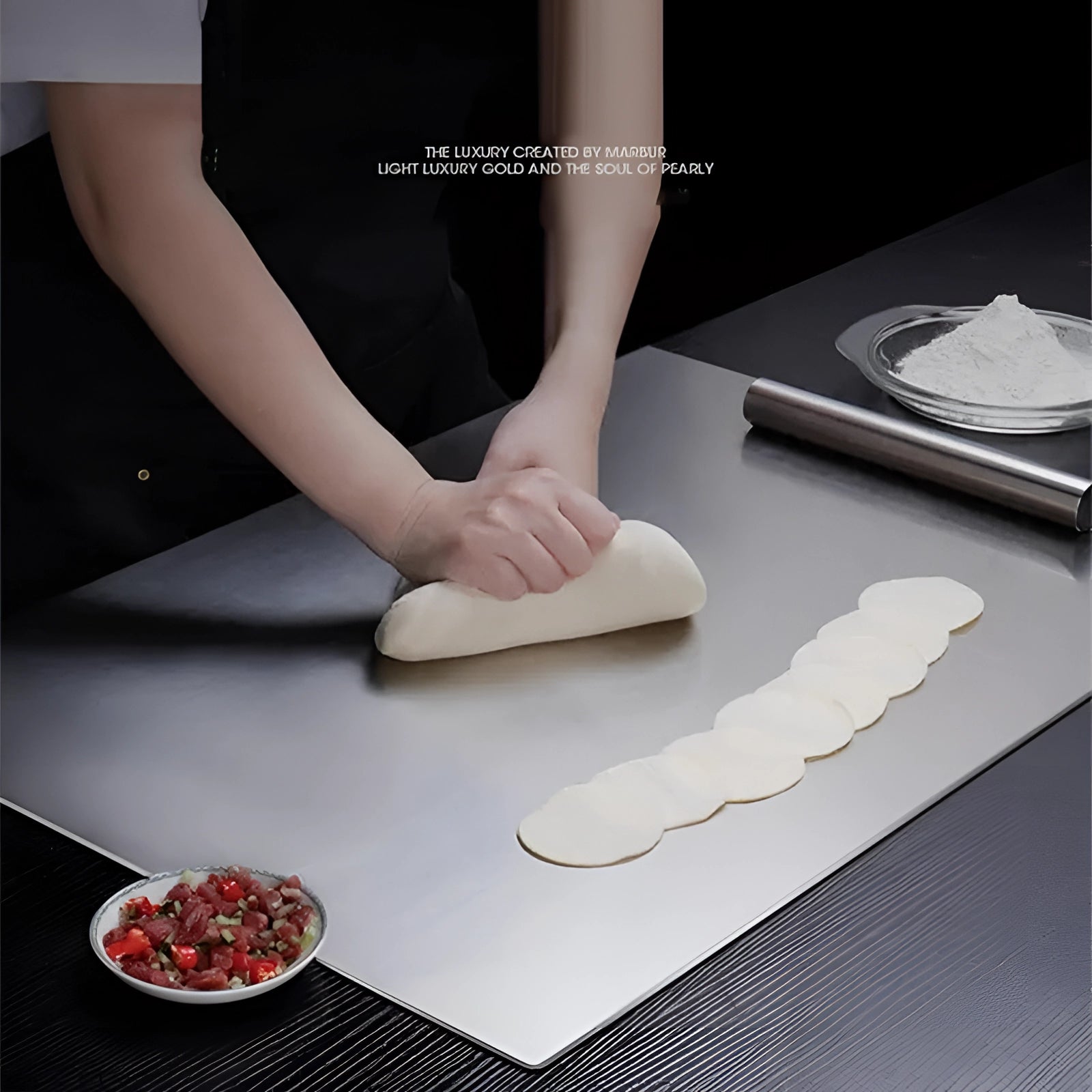 A hand using a stainless steel cutting board placed on a wooden table, demonstrating a space-saving and hygienic kitchen tool.