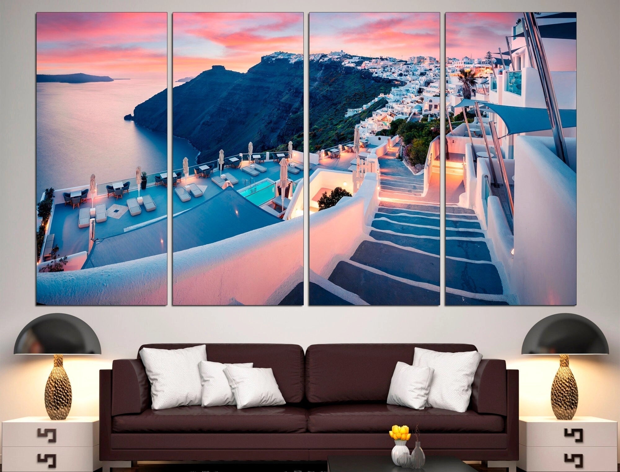 Large Santorini Canvas Print in 4-panel format, measuring 101"x57", showcasing a Greek travel scene with a prominent blue and azure color palette. The canvas print is displayed above a comfortable studio couch in a living room setting.