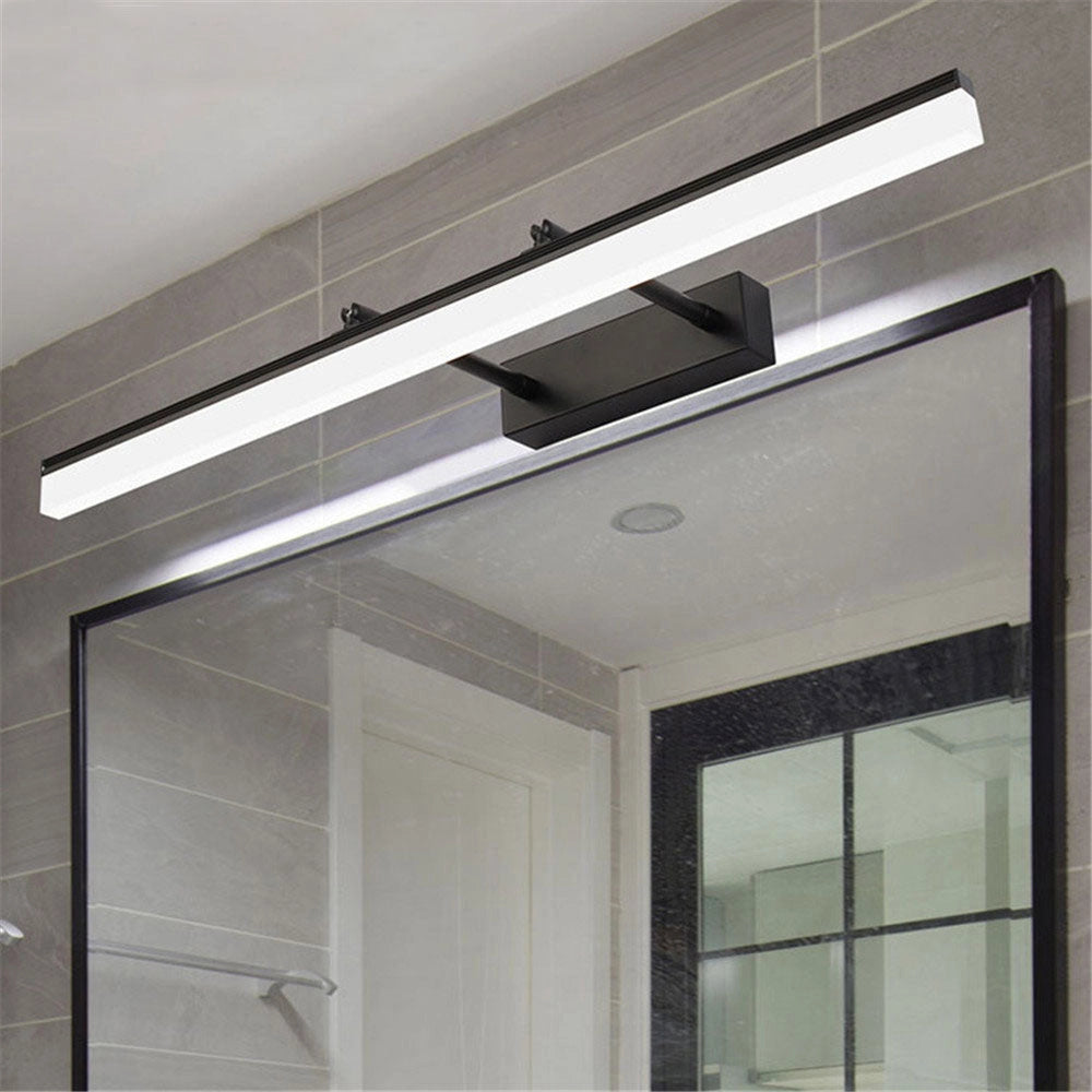 Modern adjustable LED bathroom vanity light with a chrome finish mounted on a wall.