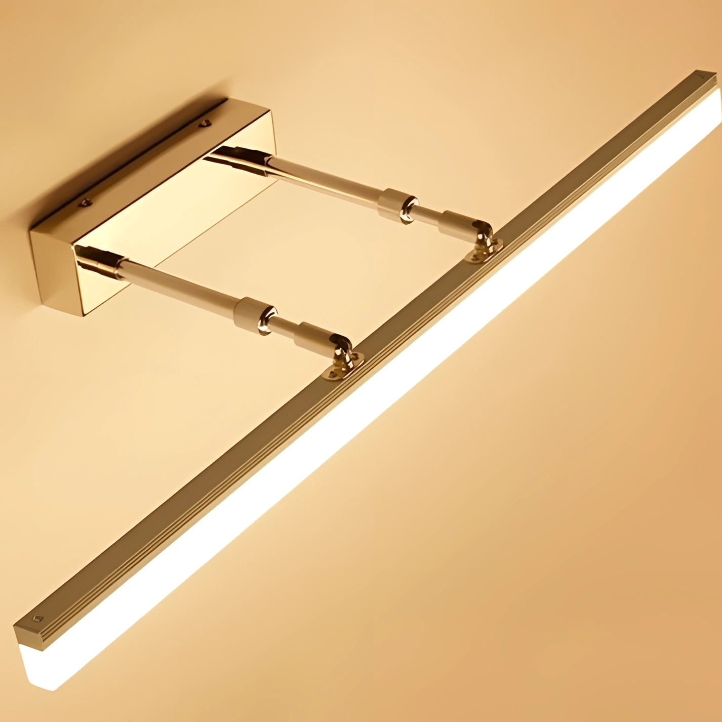 Modern LED bathroom vanity light with adjustable design, featuring a chrome finish and rectangular shape, mounted on a wall.