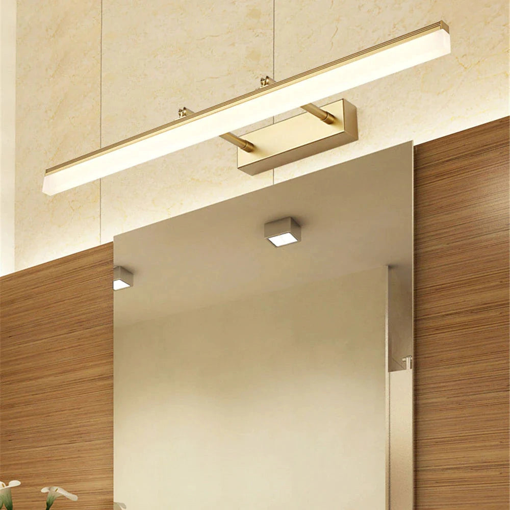 Modern chrome finish LED bathroom vanity light with adjustable wall sconce mounted above a wooden surface, featuring a glass shade.