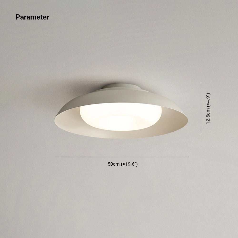 Modern minimalist round LED ceiling light with a soft-white glow, flush-mounted on the ceiling.