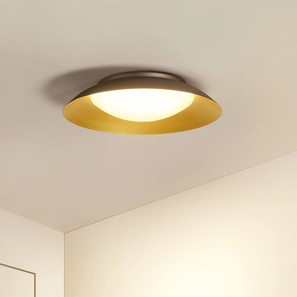 Modern minimalist round LED ceiling light with a soft-white flush mount design, featuring a sleek circular shade suitable for indoor spaces.