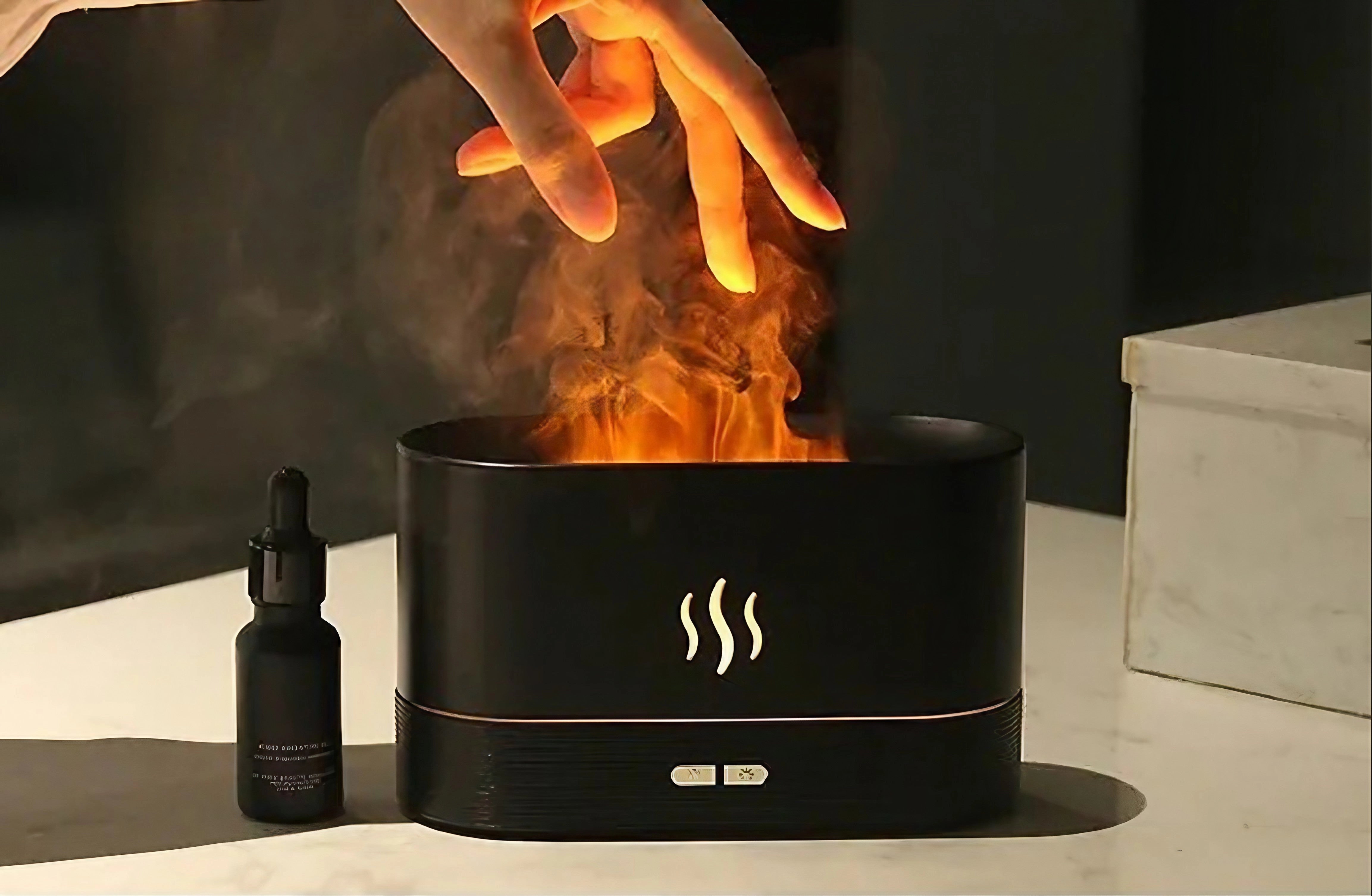 Black LED Flame Aroma Diffuser & Ultrasonic Mist Maker Humidifier with a modern design, emitting a warm flame-like light while dispersing aromatic mist into the air.