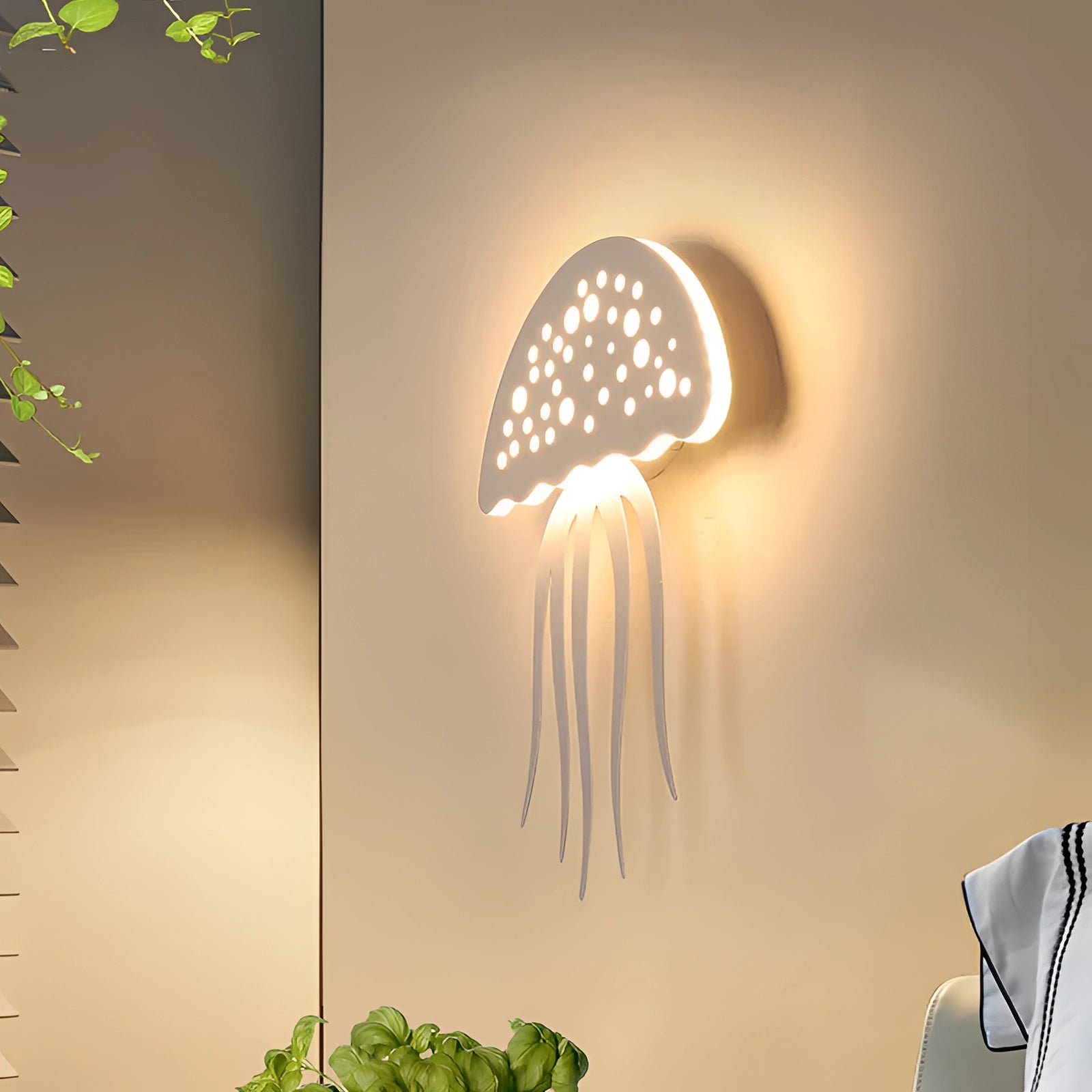 LED Jellyfish Wall Light with warm white illumination, featuring an ocean-themed design and eco-friendly materials, mounted on a wall.