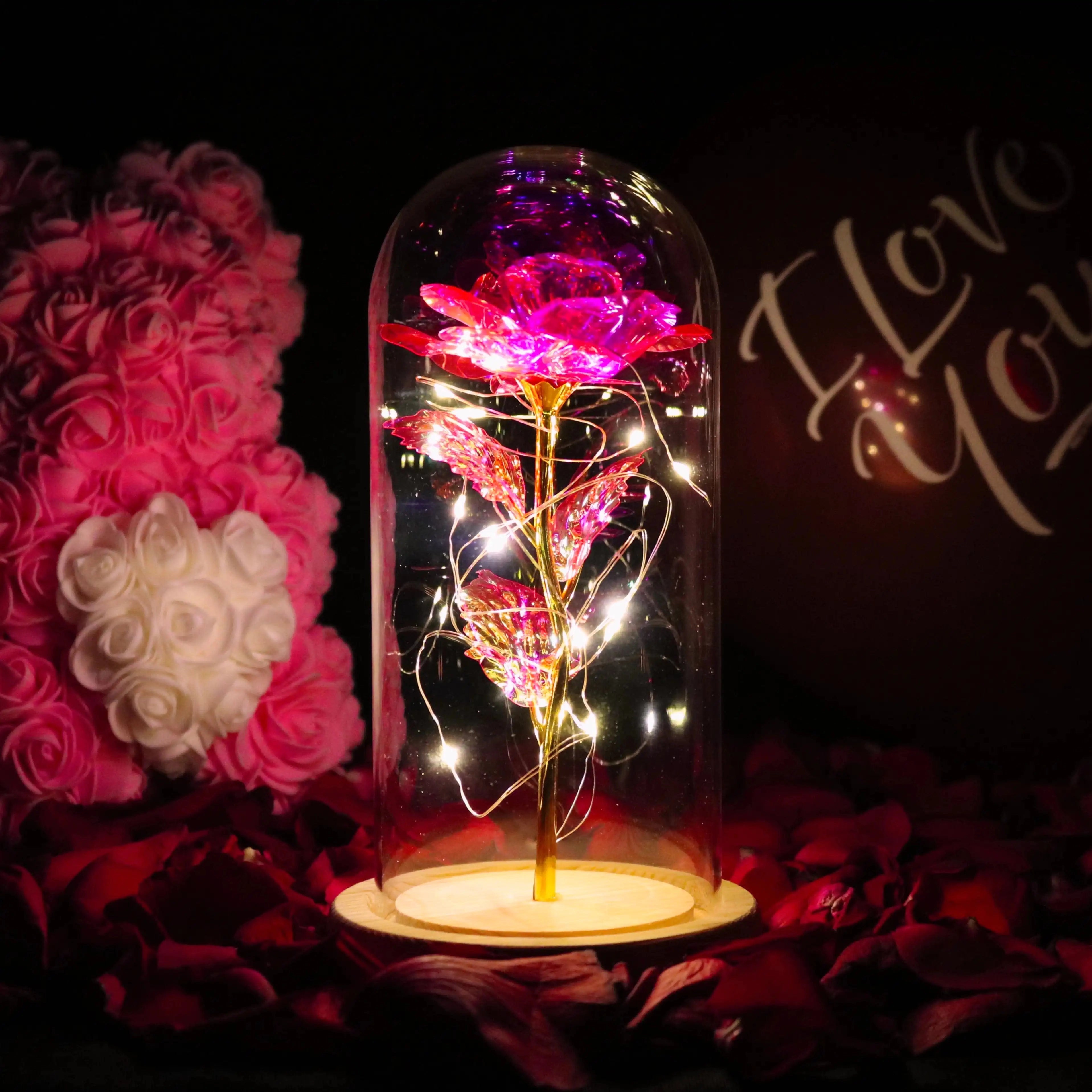 Opalrose LED rose dome featuring a vibrant pink and magenta enchanted rose surrounded by delicate fairy lights, perfect for decoration and creating a magical atmosphere.