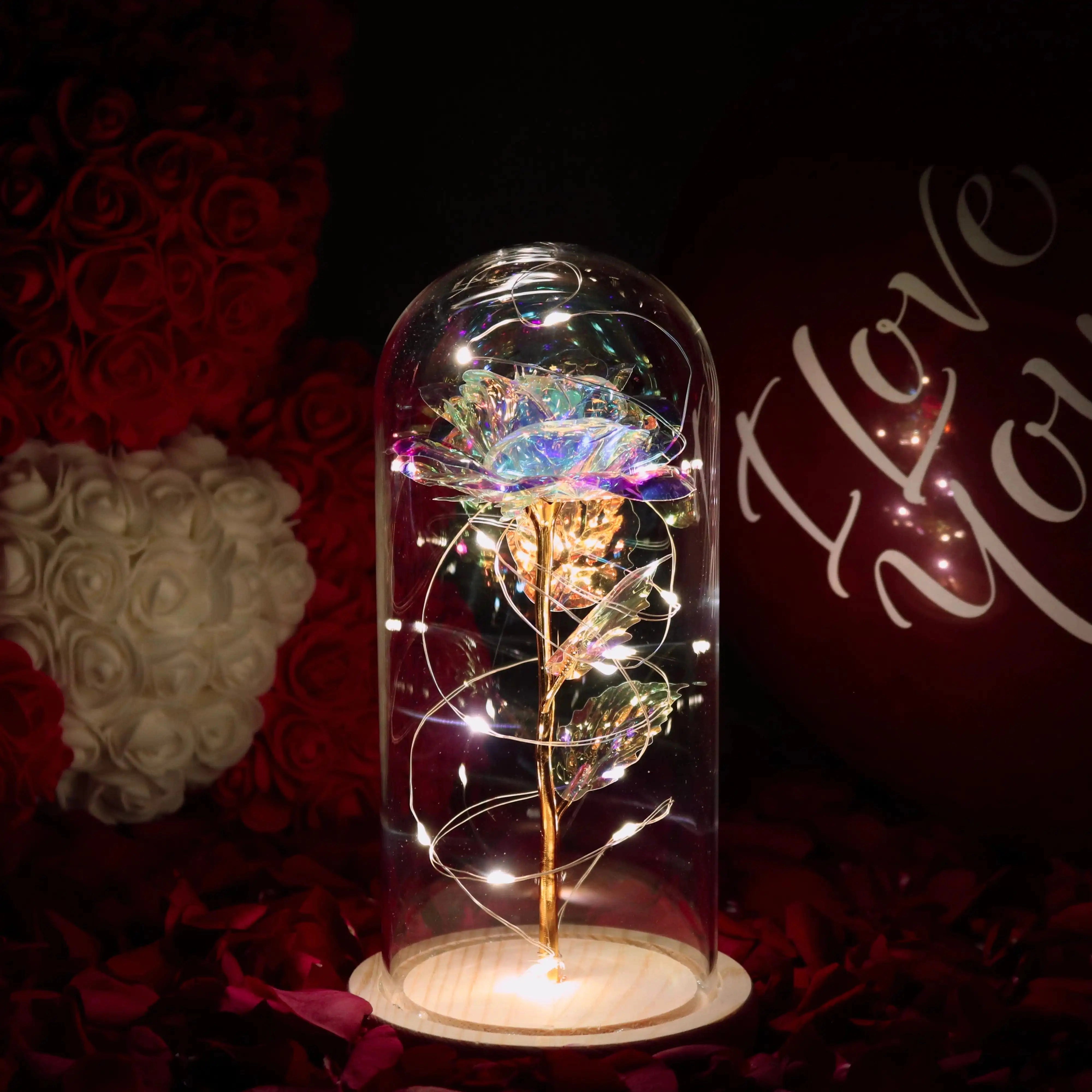 LED rose dome featuring a galaxy-themed enchanted rose light surrounded by delicate fairy lights within a glass dome, creating a magenta-tinted, ornamental decoration suitable for events or ambient decor in dark settings.