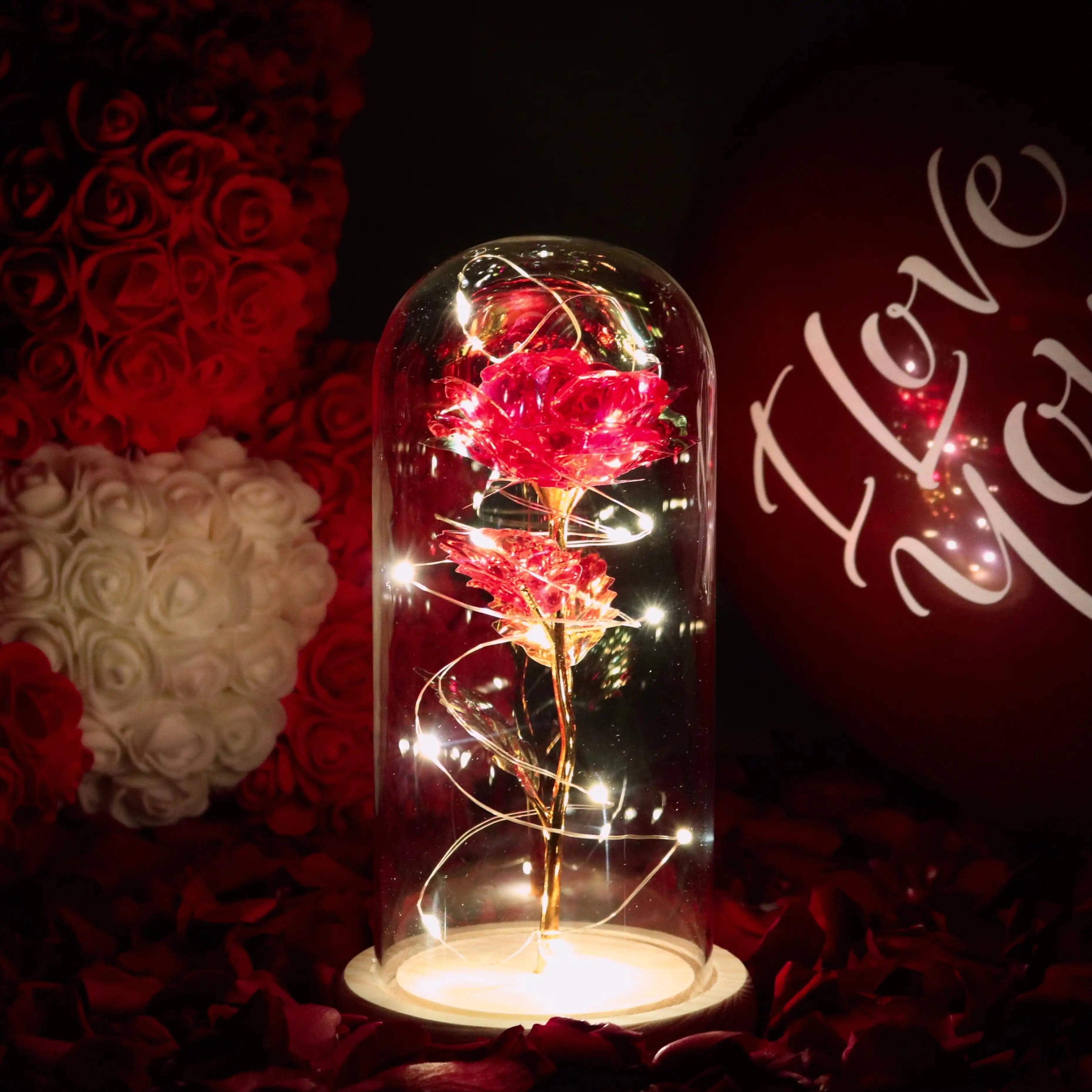 Enchanted rose light decor in ruby red with LED fairy lights inside a glass dome, featuring vibrant red petals and a creative, magical ambiance.