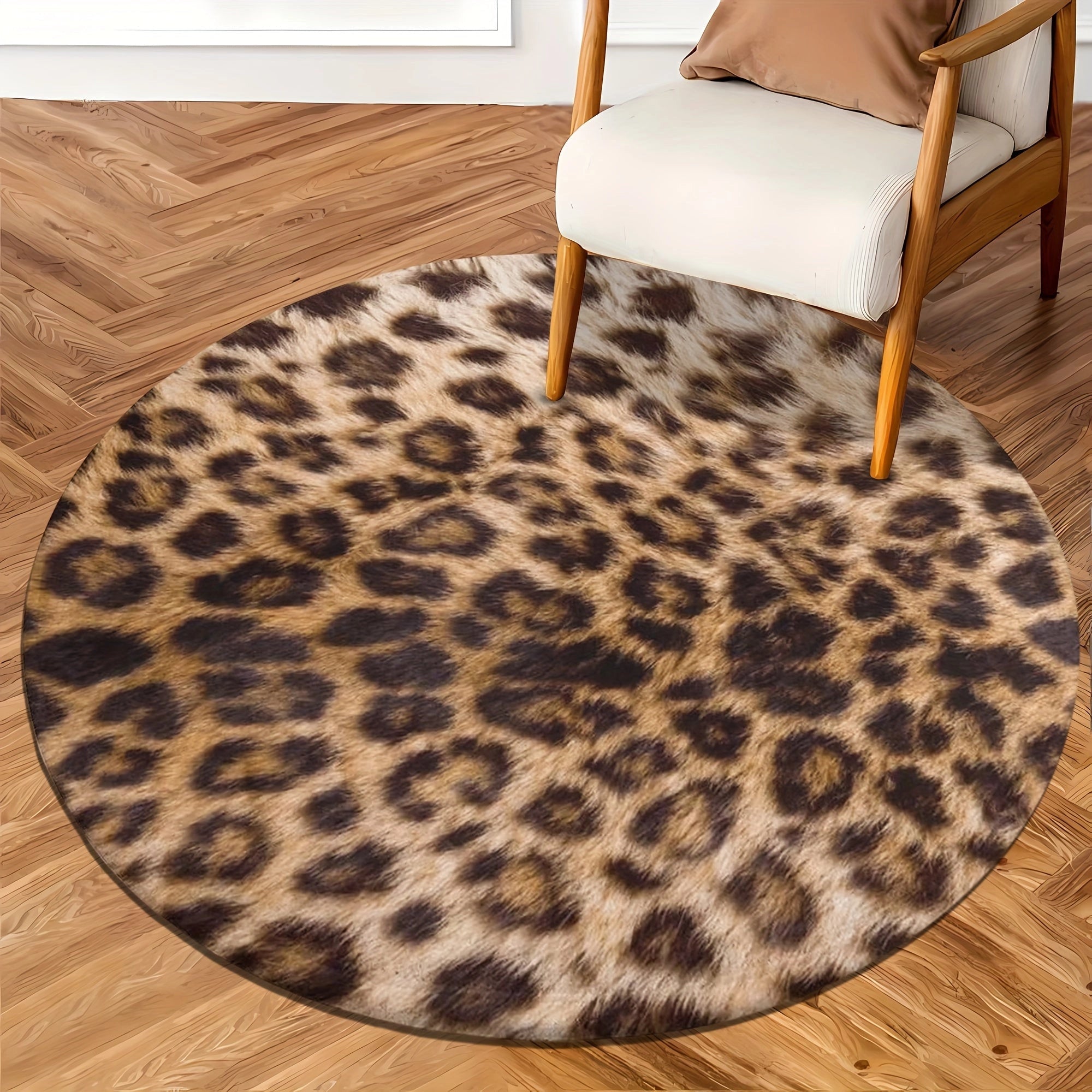 Leopard print round rug with faux fur texture in shades of brown and black, placed on a wooden floor, enhancing modern decor with its cozy and stylish design.