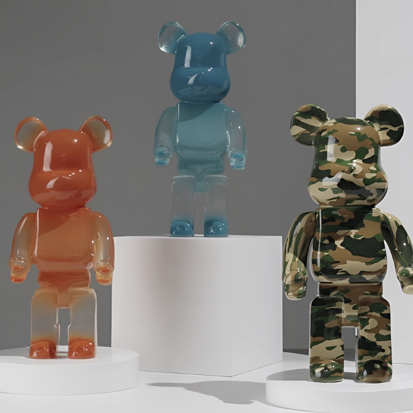 Clear vinyl bear-shaped designer art toy figurine with a camouflage pattern, resembling a teddy bear in a collectible edition.