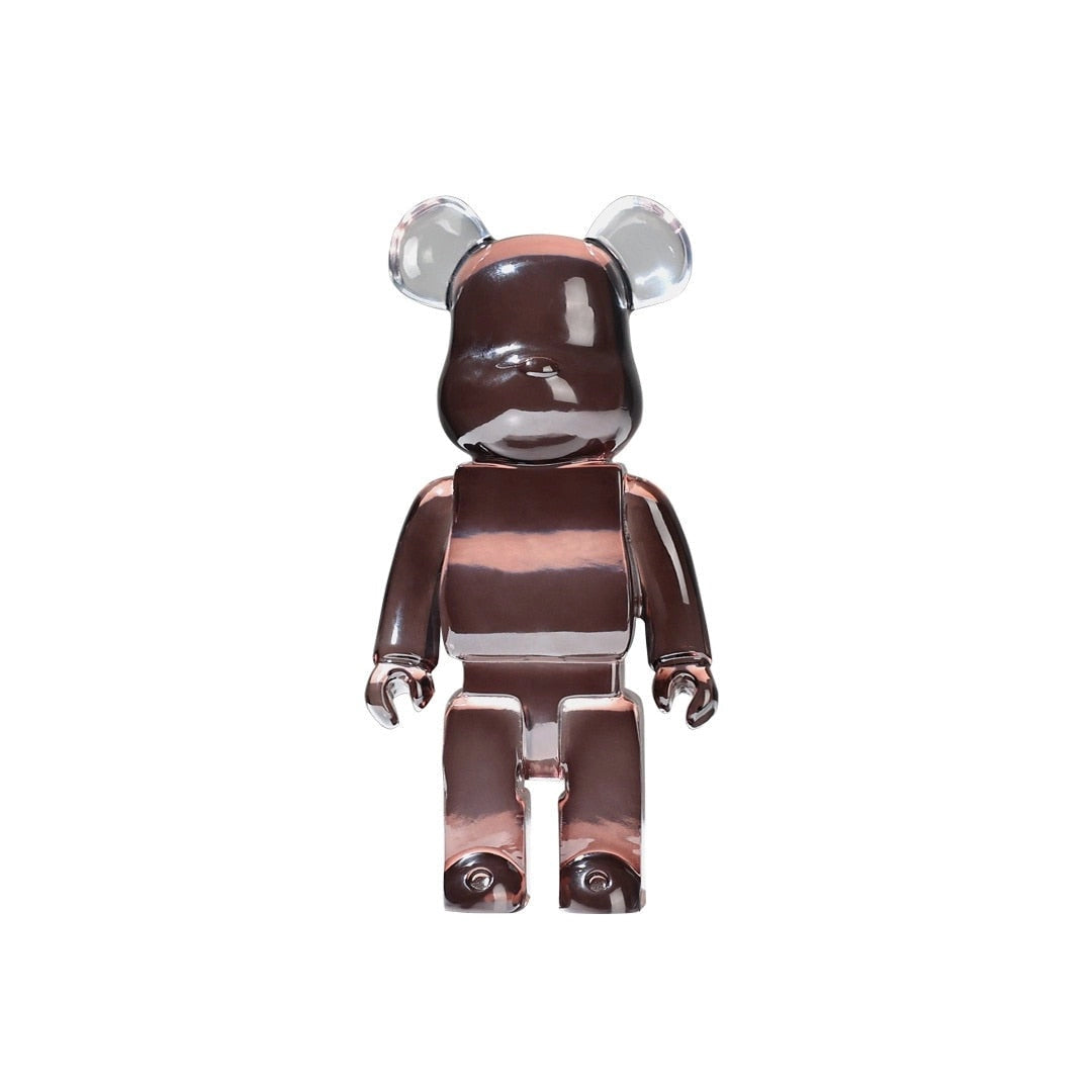 Clear Vinyl Bearbrick designer art toy figurine in a limited edition Clear Coffee variant, featuring transparent brown tones and intricate detailing similar to that of an action figure.