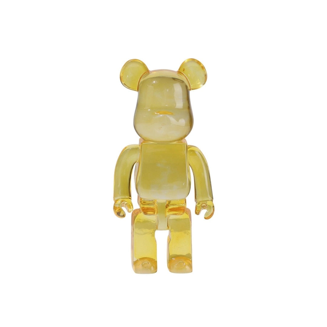 Clear yellow limited edition Bearbrick vinyl art toy figurine in the shape of a teddy bear with transparent design elements.