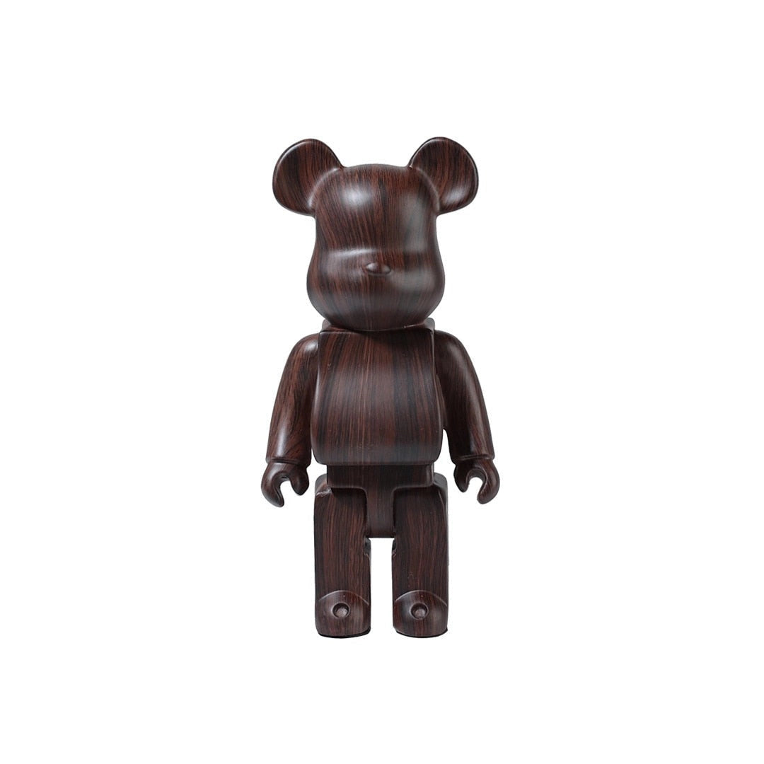 Limited Edition Clear Vinyl Bearbrick Designer Art Toy Figurine with a Dark Wood Pattern, featuring a brown-toned animal figure design that resembles a bear.