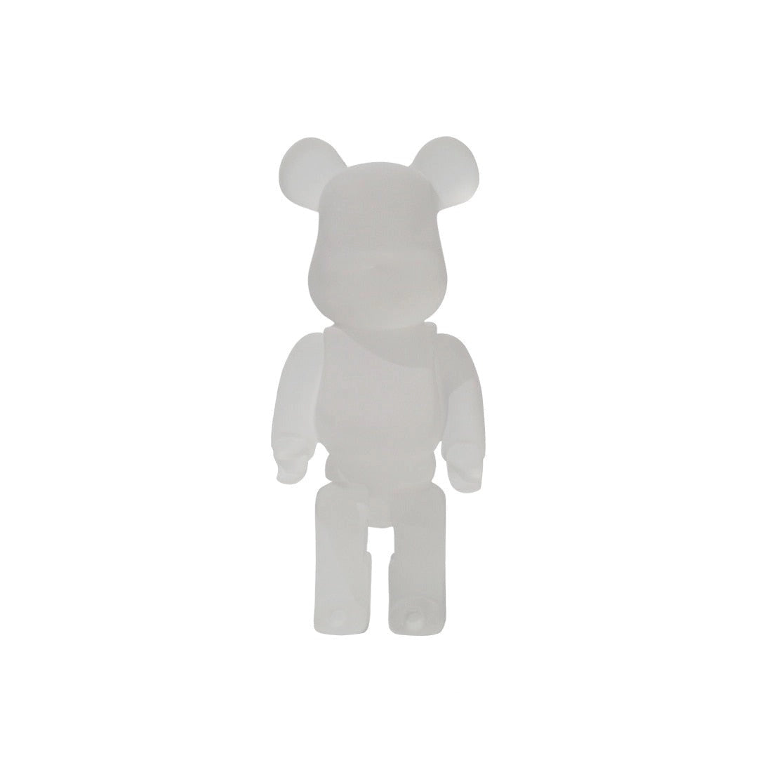 Limited Edition Frosted Clear Vinyl Bearbrick Designer Art Toy Figurine featuring a bear-shaped design with a transparent frosted finish, showcasing artistic details and a logo, resembling a collectible toy figure.