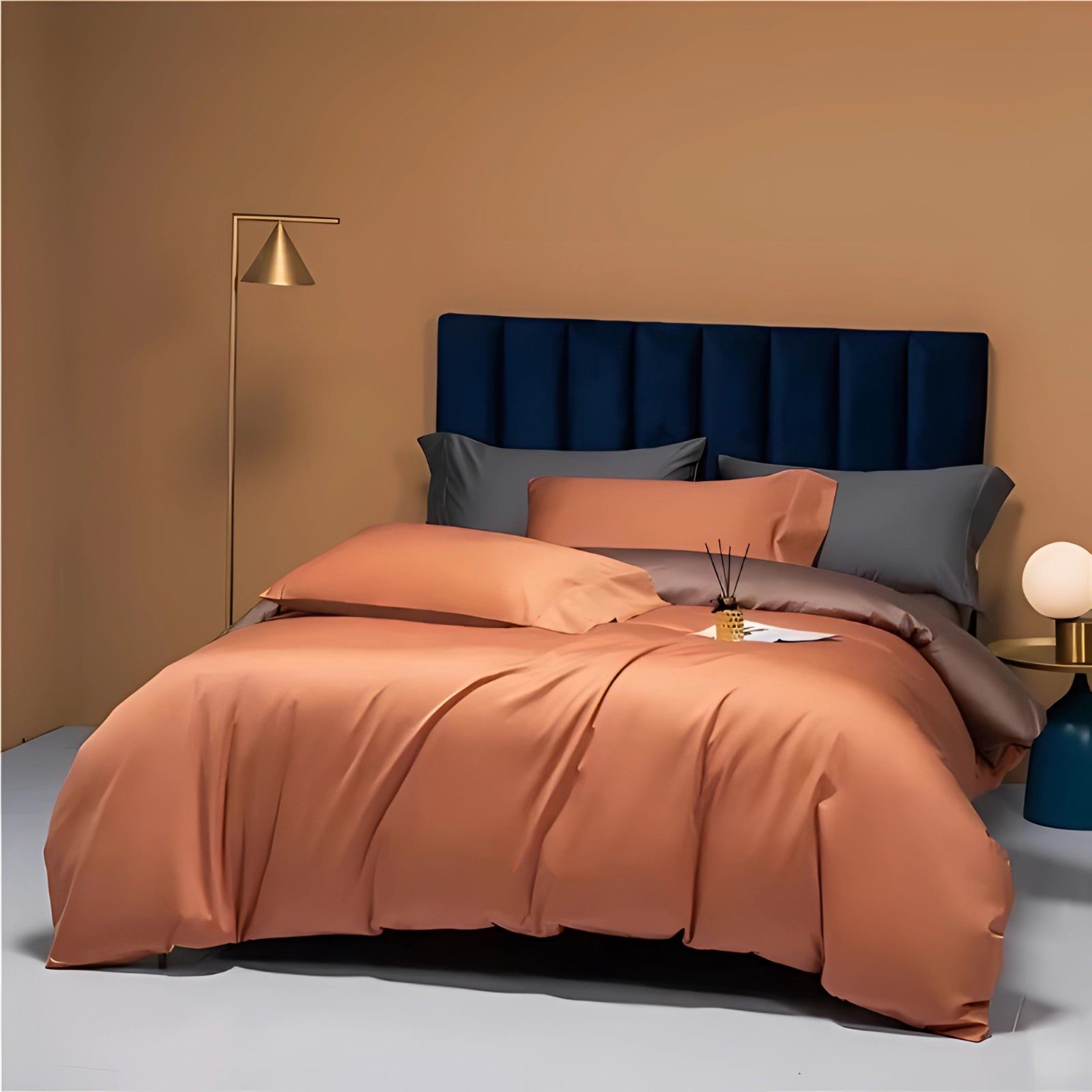 Brown luxury bedding set on a king-sized bed featuring high-end Egyptian cotton linens, surrounded by a wooden bed frame, pillows, and interior design elements including a lamp.