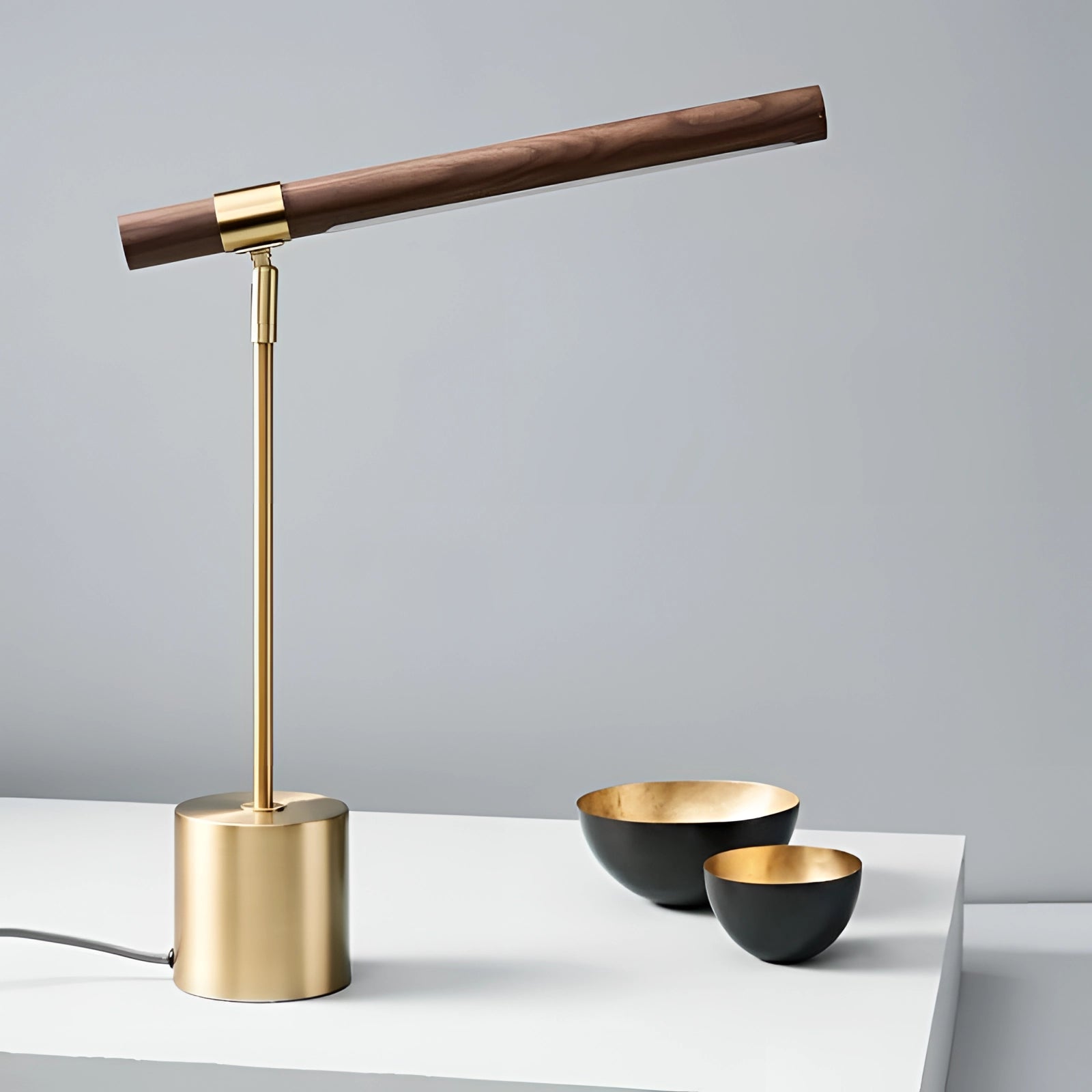 Luxury Brass and Wood Adjustable Desk Lamp on a Modern Office Desk