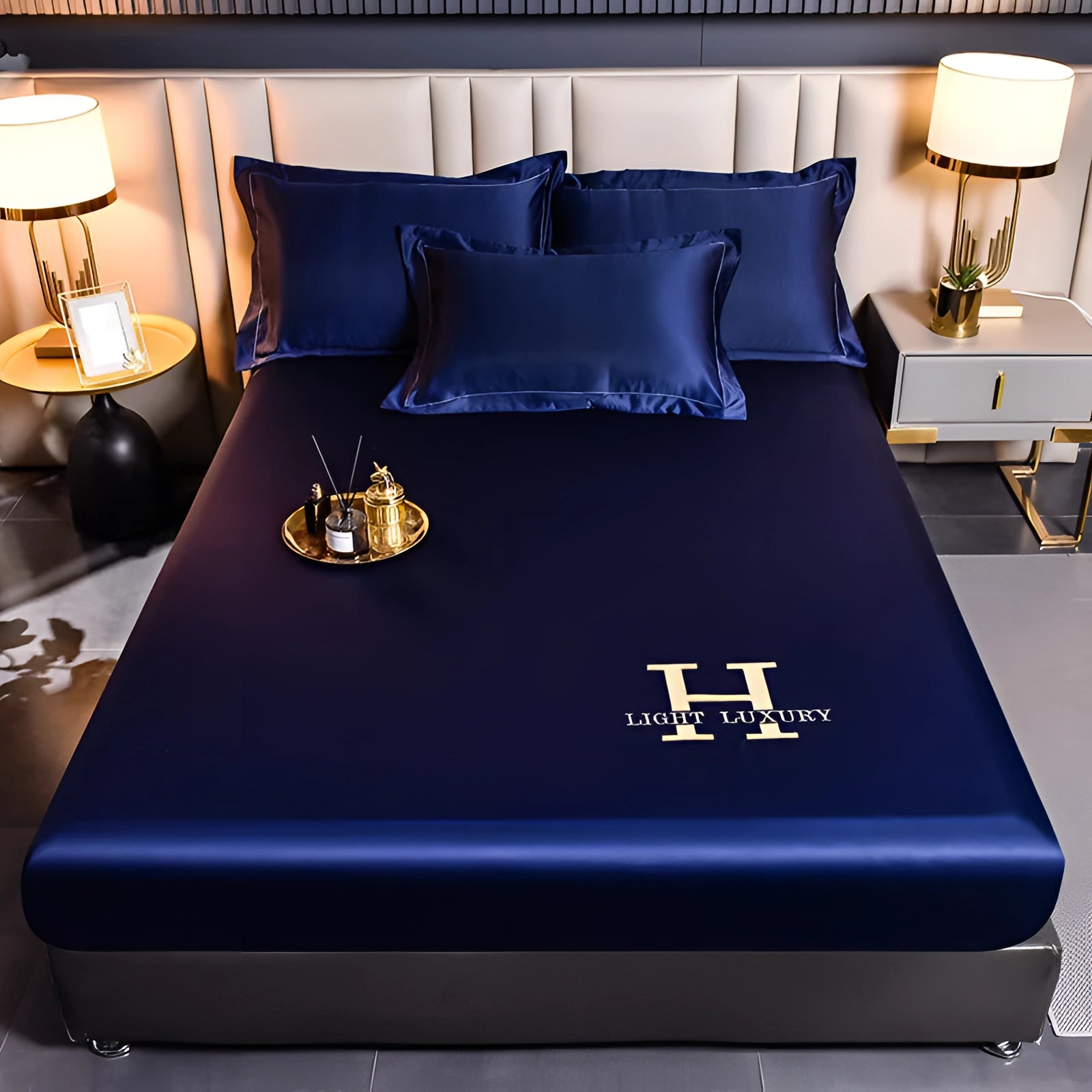 Luxurious blue satin bedding set featuring premium silk sheets and matching pillowcases elegantly displayed on a plush bed with soft lighting.