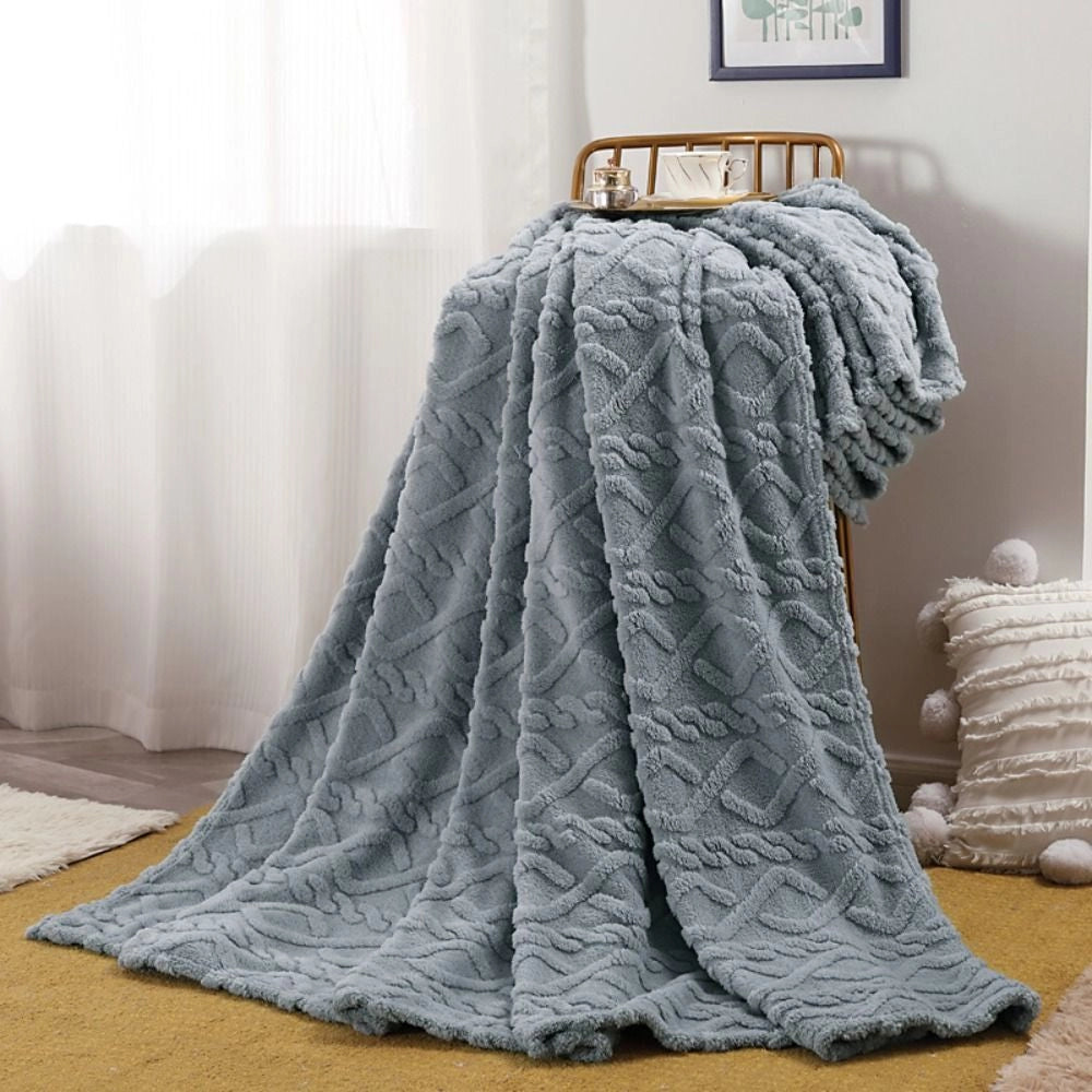 Elegant light blue cable knit throw blanket, measuring 200x230cm, displayed draped over a clothes hanger showcasing its intricate pattern and smooth texture, suitable for adding a cozy and sophisticated touch to any room.