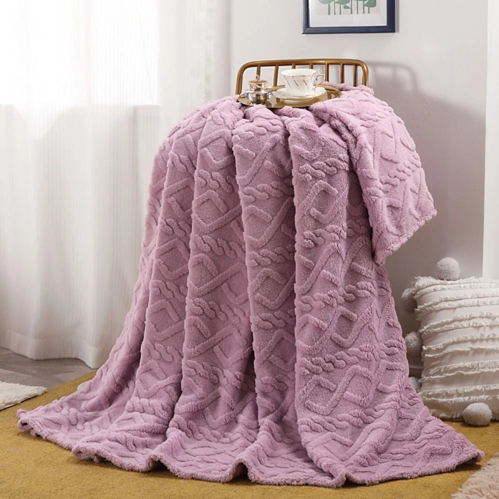 A luxurious purple cable knit throw blanket measuring 200x230cm, elegantly draped on a clothes hanger showcasing its cozy, high-quality craftsmanship and natural material.