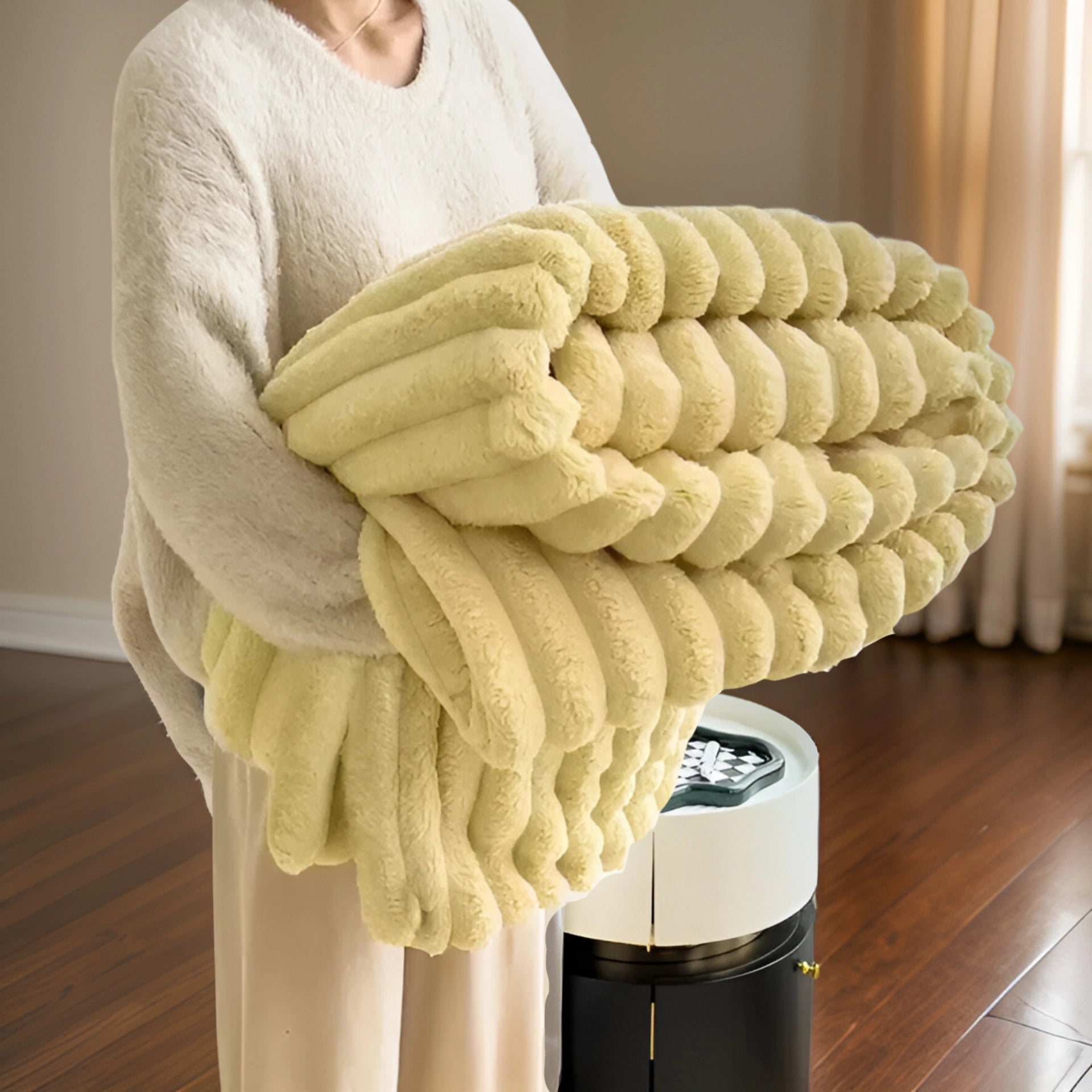 Luxurious chunky knit blanket in a soft yellow color draped elegantly on a hardwood floor, with gentle folds showcasing its plush texture. The scene highlights a modern and cozy home decor setting.