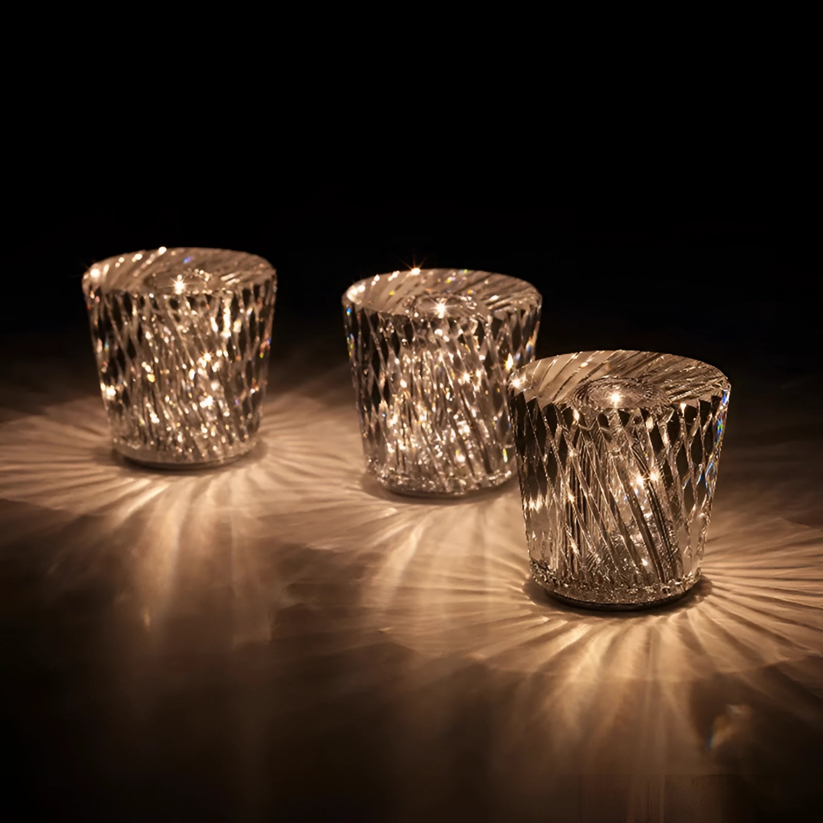 Luxury crystal candle holder made of diamond-cut glass with a circular shape, featuring transparent and reflective properties, suitable for elegant table decor at events.