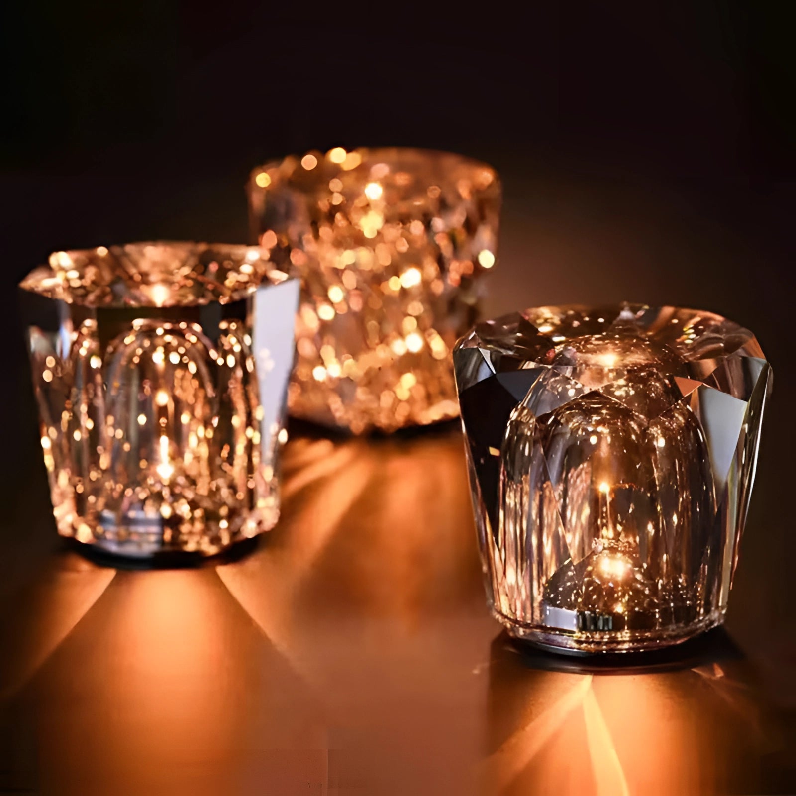 Luxury crystal candle holder made of diamond-cut glass, designed for votive candles, showcasing a transparent, jewel-like appearance suitable for elegant table settings and events.