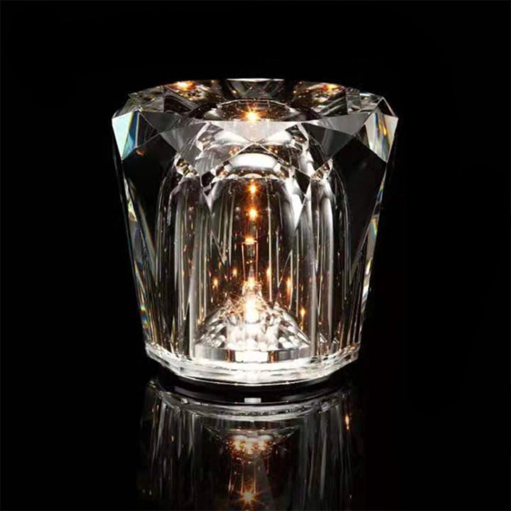 Luxury crystal candle holder made from diamond-cut glass, featuring a transparent material design that beautifully reflects light, creating an elegant decor piece for any setting.