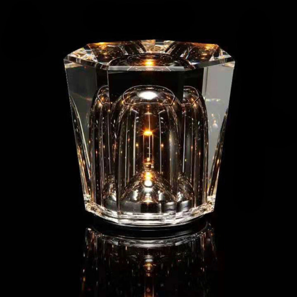 Luxury crystal candle holder made from diamond-cut glass, showcasing intricate design and transparent material, elegantly reflecting light.