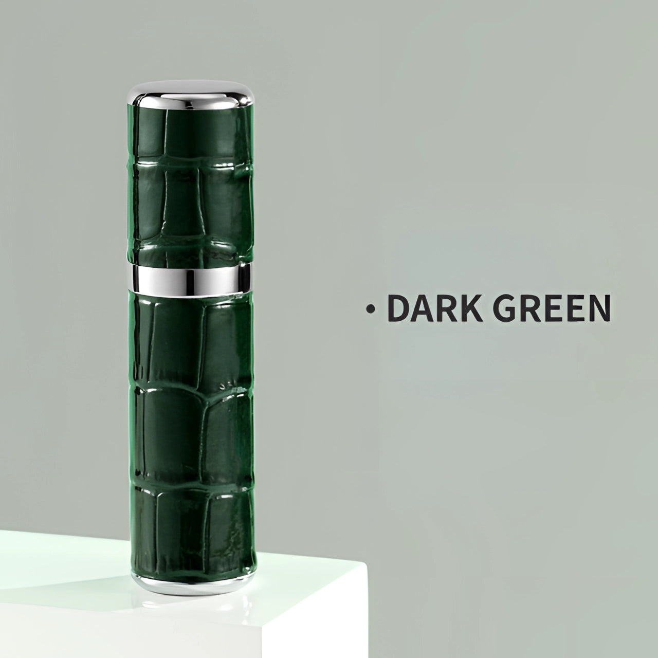 Luxury designer lipstick with crocodile skin texture packaging in dark green, featuring a sleek rectangular and cylindrical shape with metallic accents, reflecting a high-end makeup aesthetic.