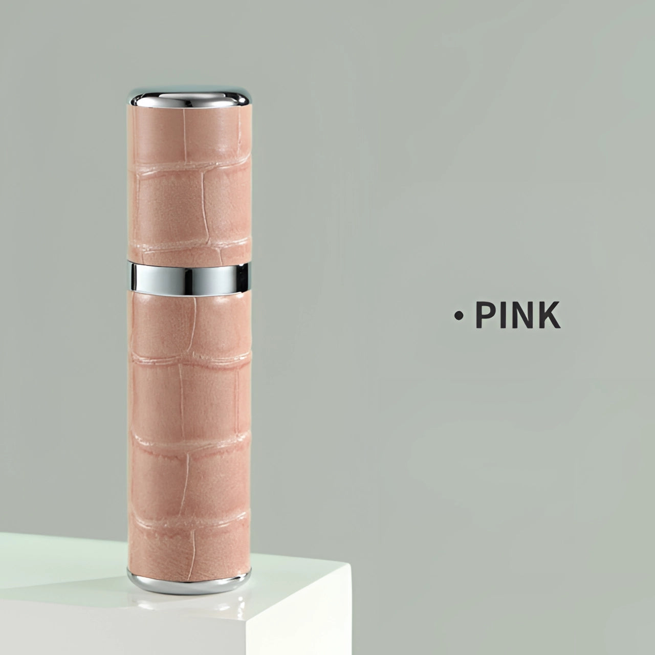 Luxury designer pink lipstick with a crocodile skin texture, featuring a sleek cylindrical metal case and a high-end, elegant design.