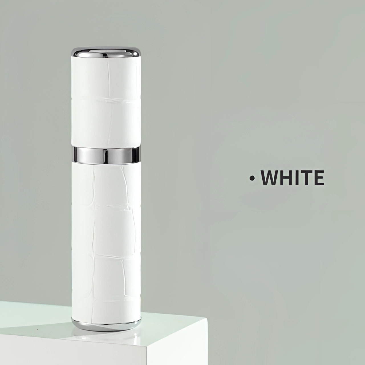 Luxury designer lipstick with a crocodile skin texture in a sleek white color, standing upright with a cylindrical shape, showcased as a high-end makeup product.